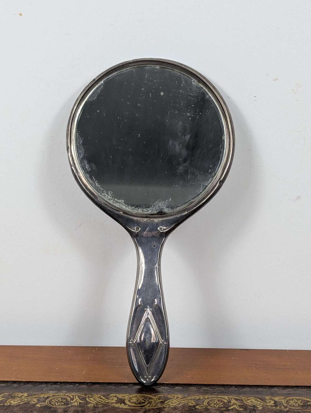 Edwardian sterling silver hand mirror by Revell & Co, Chester 1915