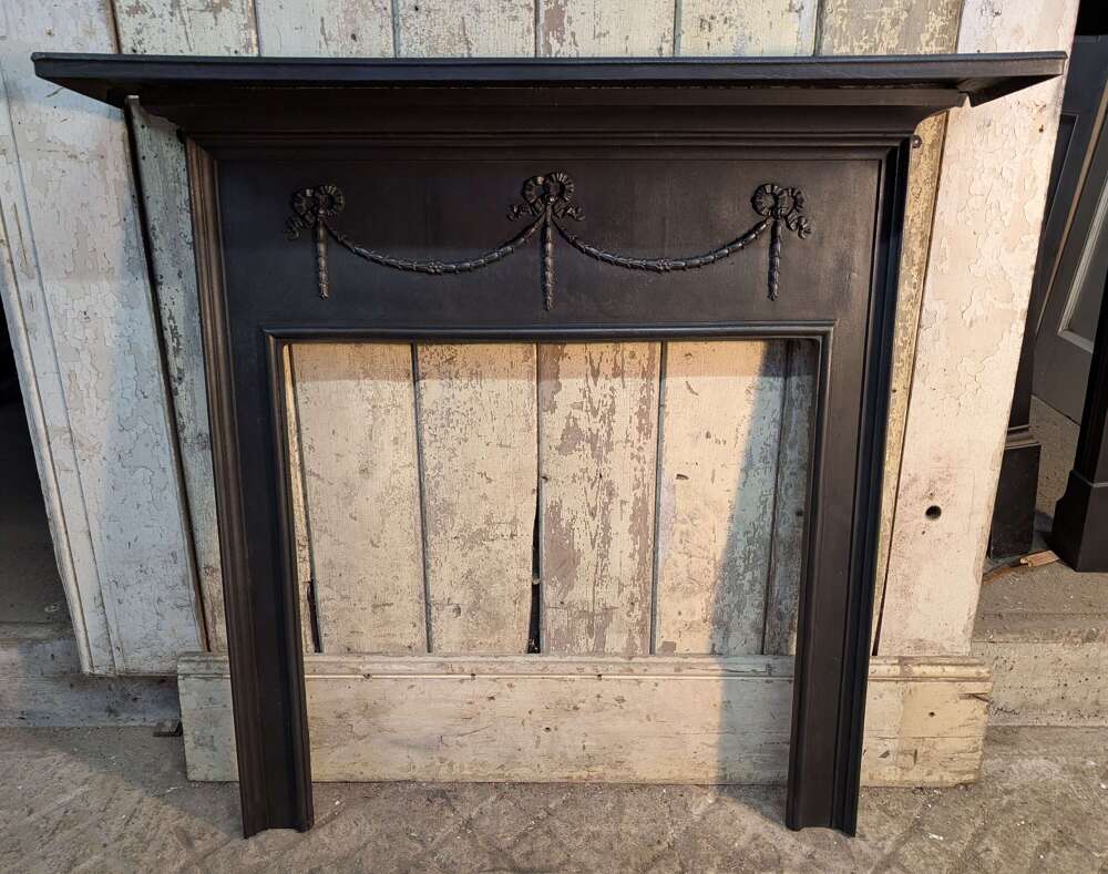 FS0450 A LARGE RECLAIMED ANTIQUE CAST IRON FIRE SURROUND C.1900