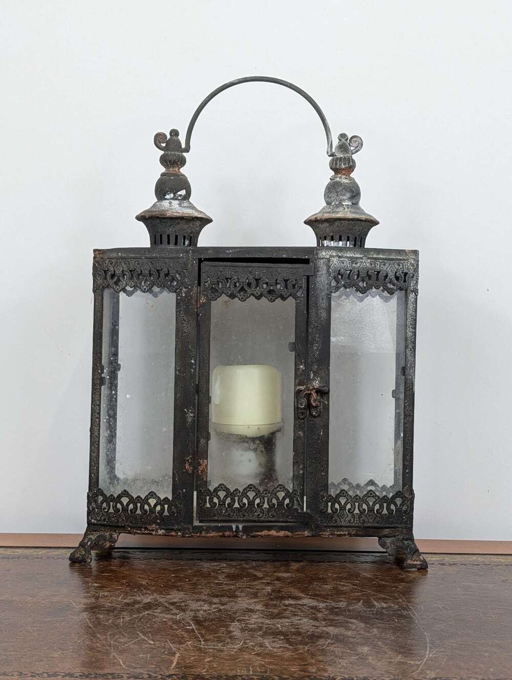 Victorian style cast iron triptych candle lantern with weathered patina
