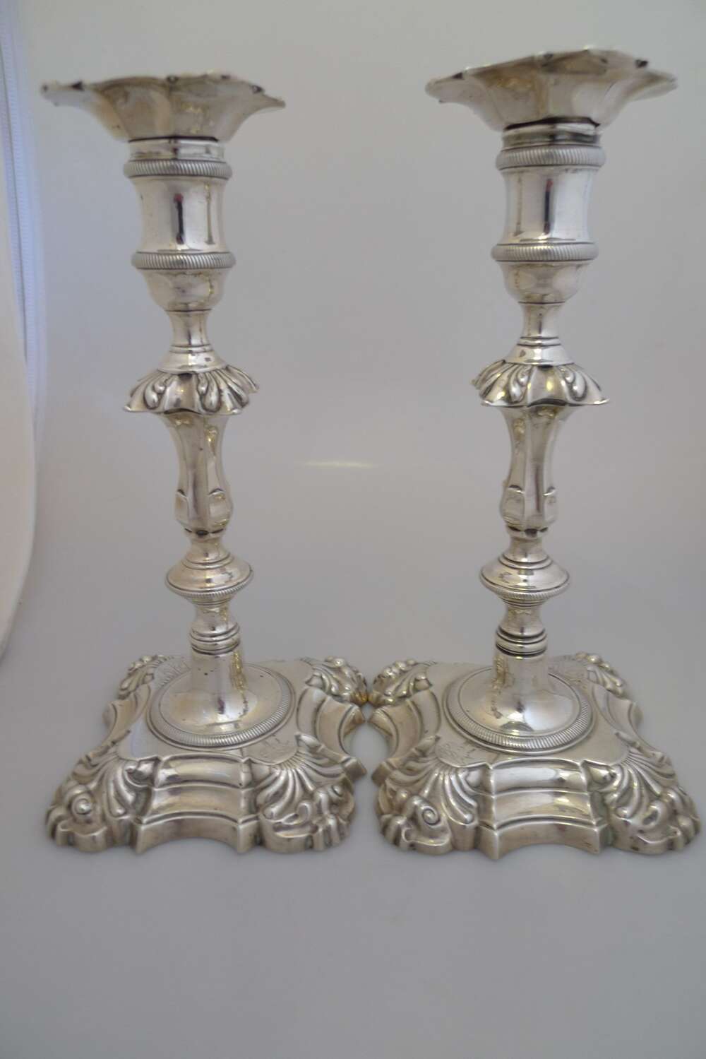 A pair of Georgian solid silver candlesticks.