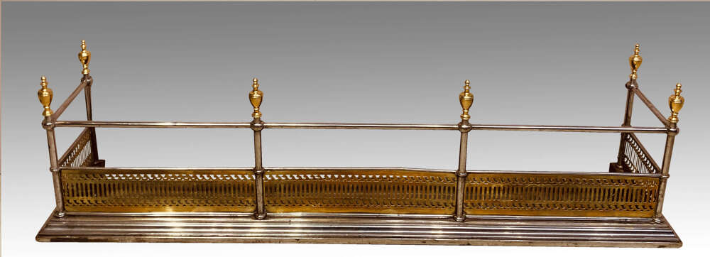 Antique steel and brass fender.