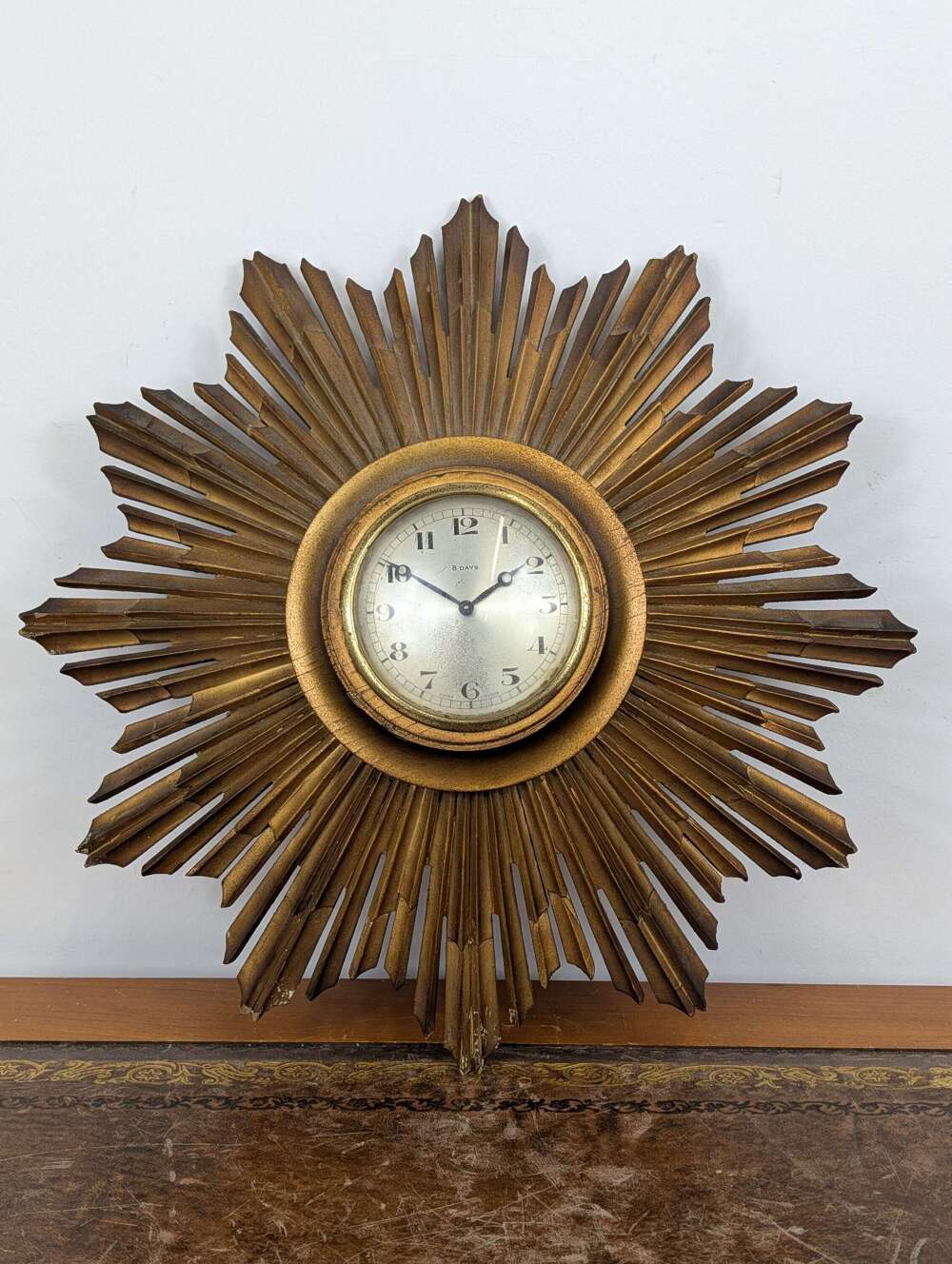 Giltwood sunburst wall clock with Swiss 8 day movement, mid 20th century
