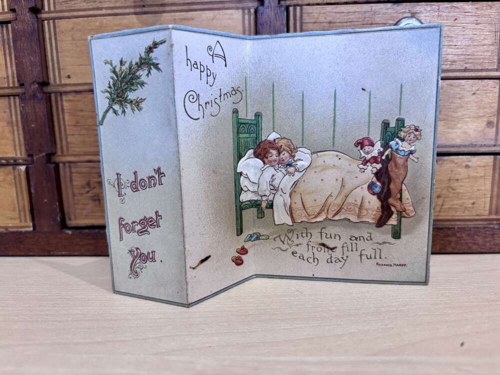 Children Waiting For santa Fold Out Bed Stocking & Toys Embossed Christmas Card c1900s