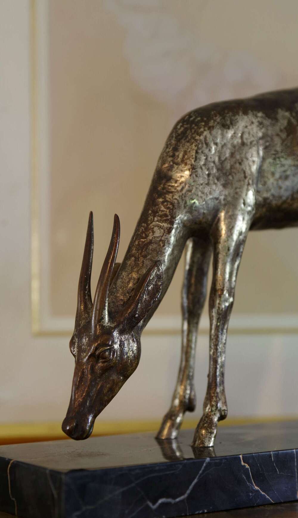 G. Rigault  - silvered bronze model of a grazing gazelle, c. 1920s.