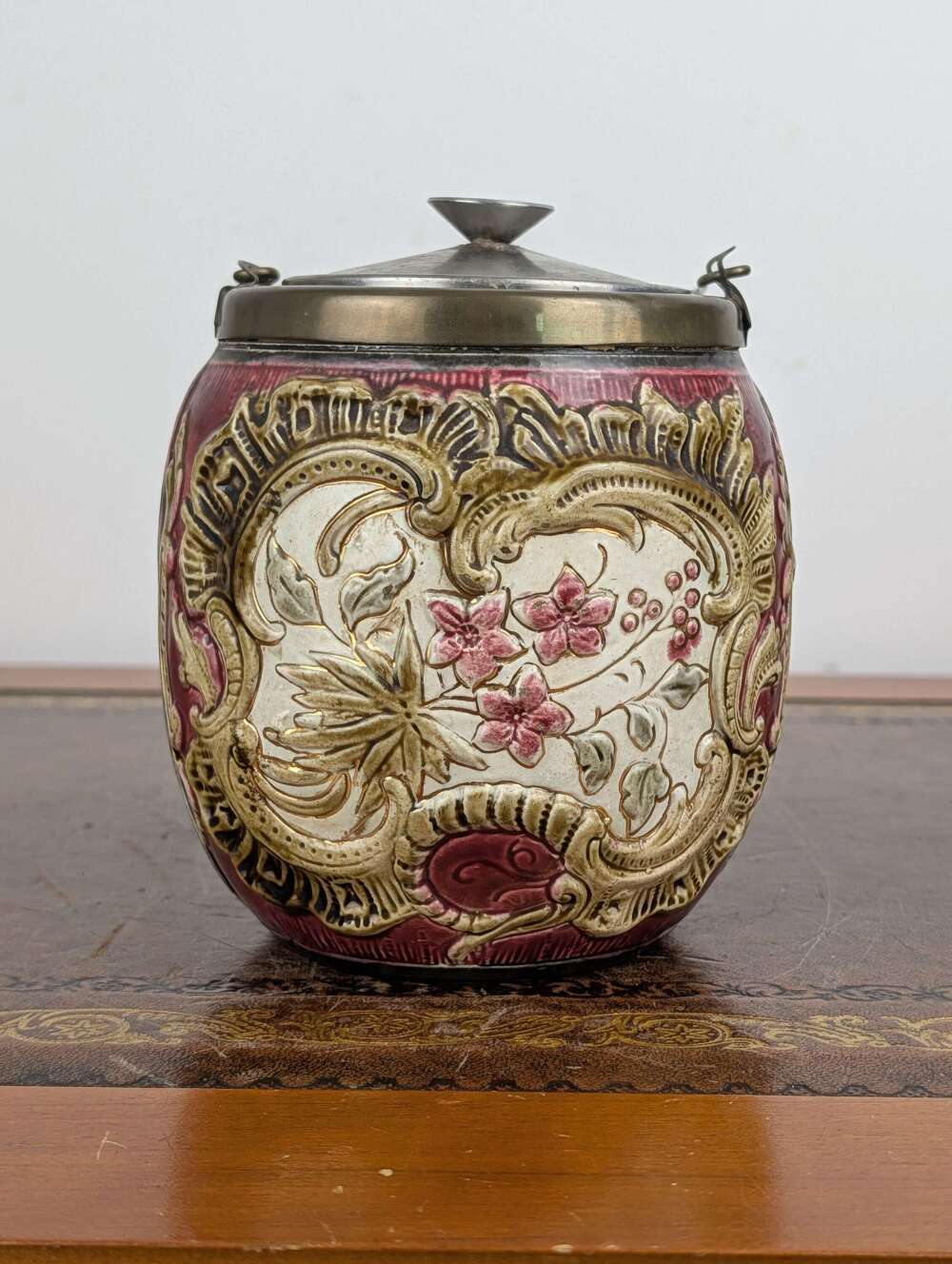 Victorian majolica biscuit barrel with floral relief and metal lid, c.1900