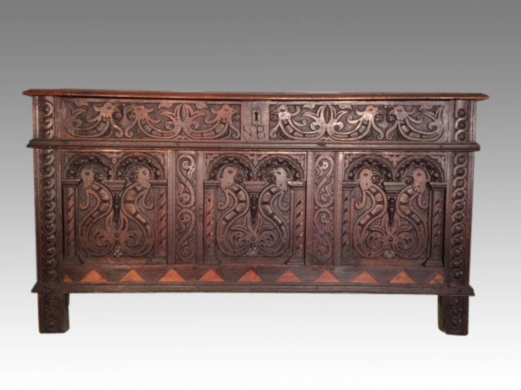 17th century antique carved oak arcaded front coffer.