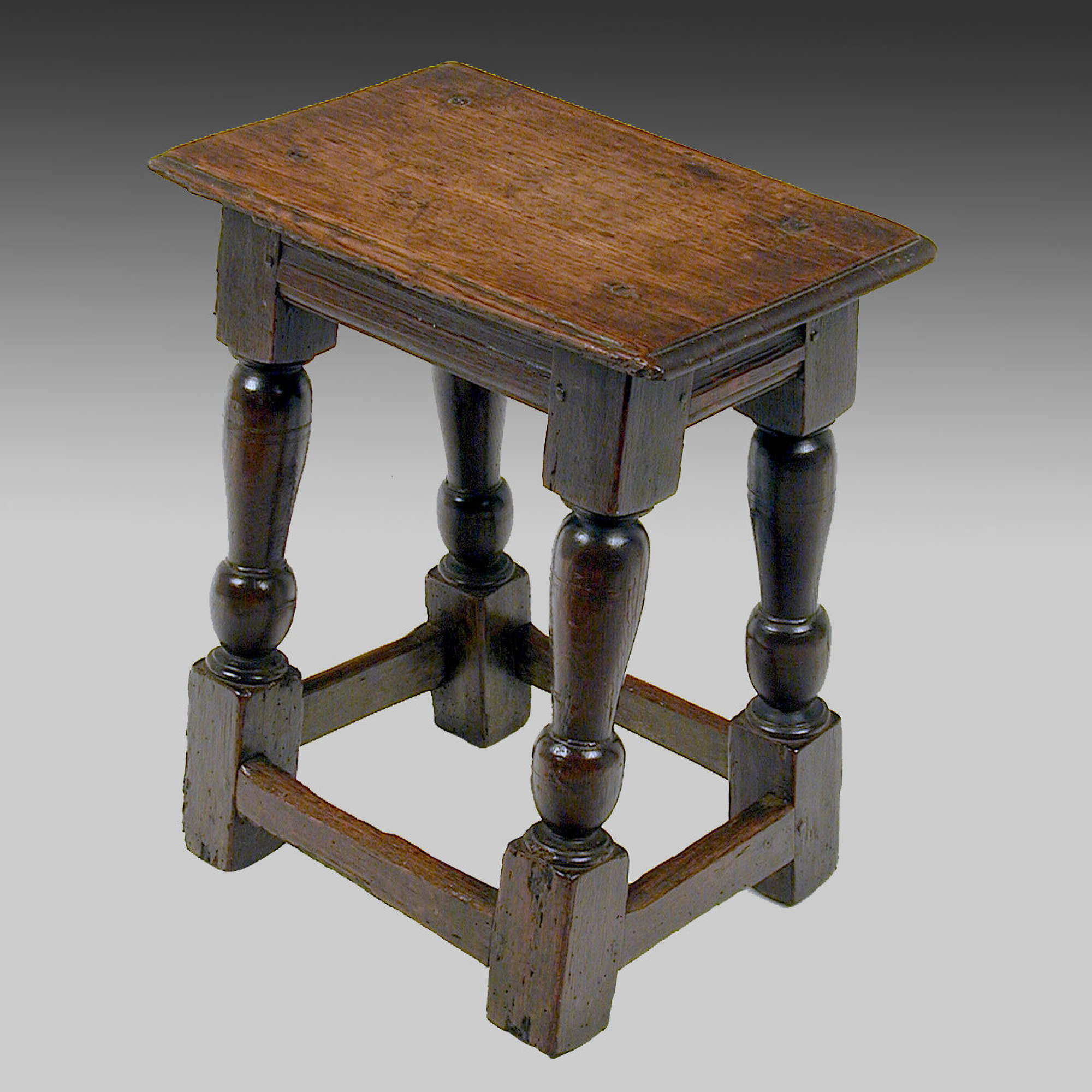 Early 17th century oak joined stool