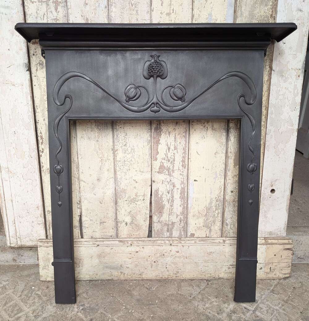 FS0465 AN ELEGANT RECLAIMED ART NOUVEAU CAST IRON FIRE SURROUND