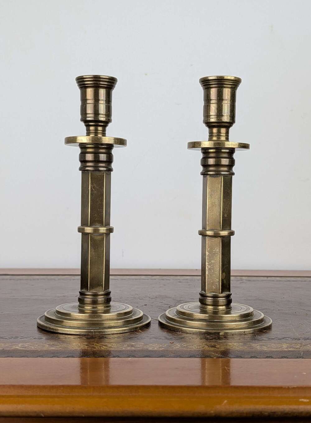 Pair of heavy brass Gothic Revival candlesticks with hexagonal stems, circa 1880