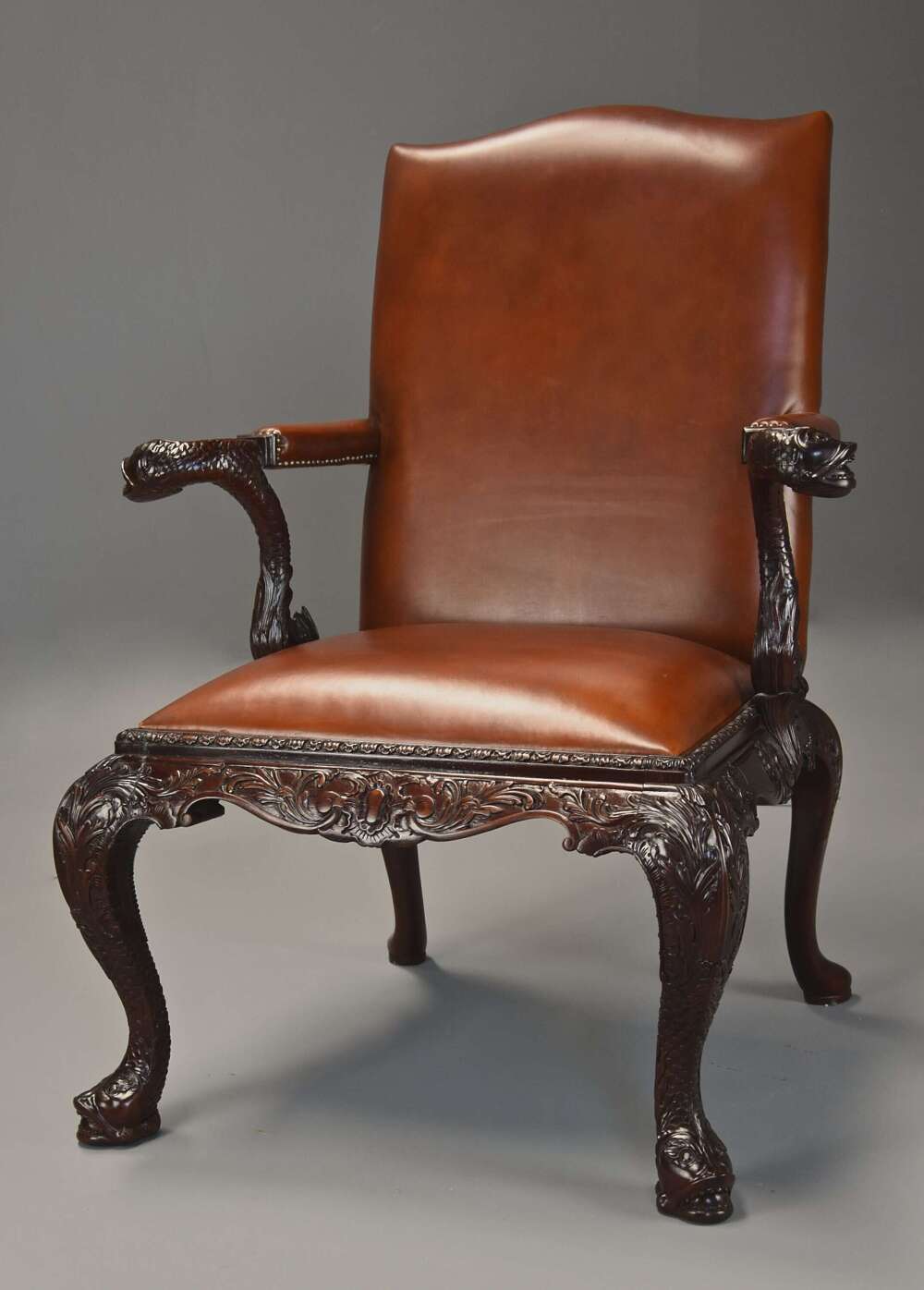 Superb quality early 20thc George II style mahogany Gainsborough leather open armchair