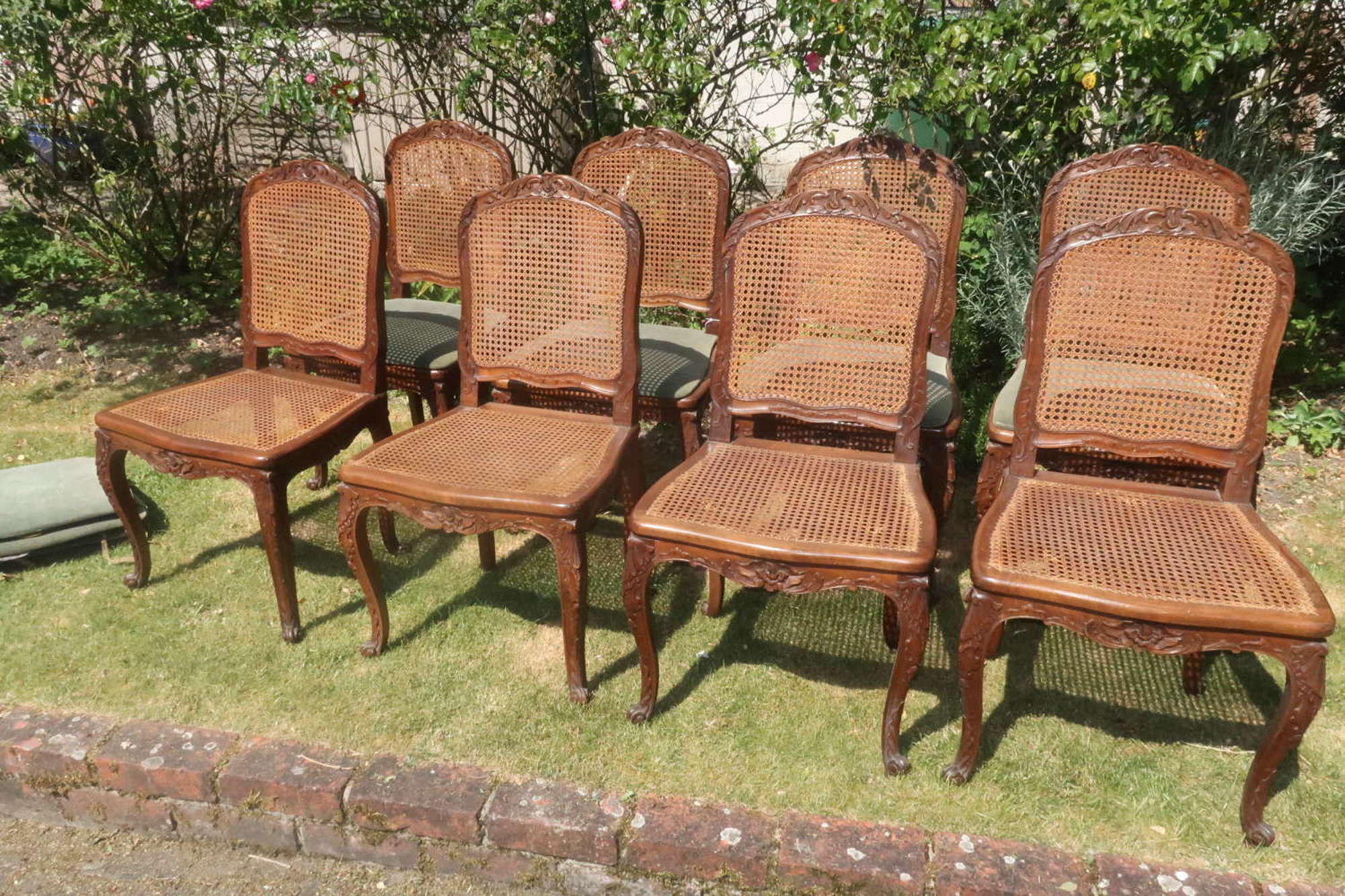 Set of eight carved walnut dining chairs