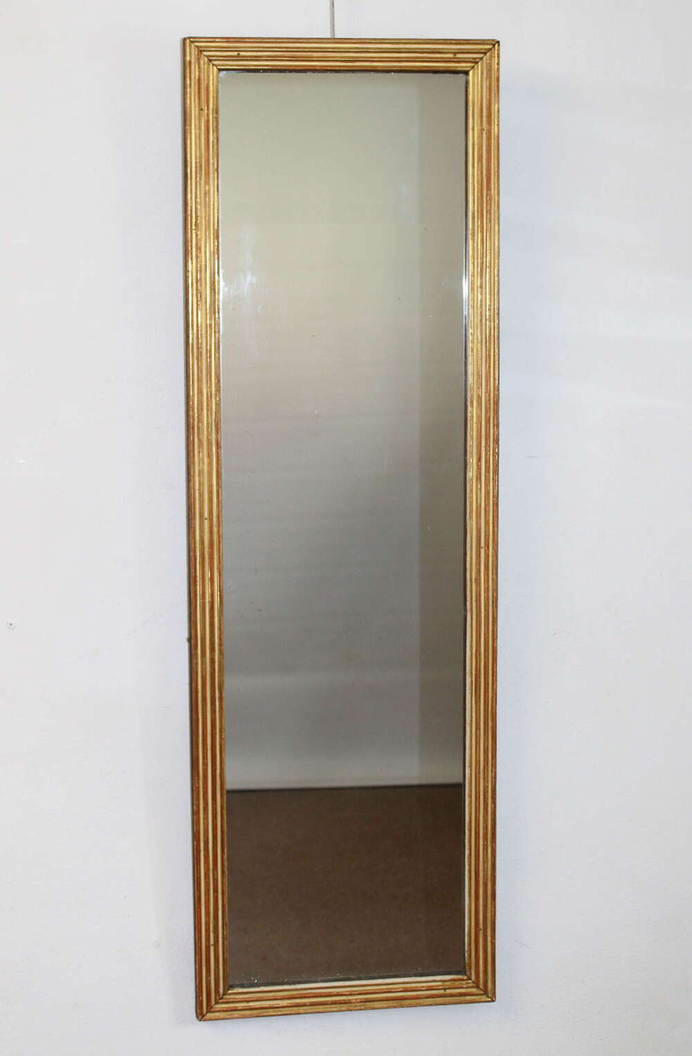 Tall narrow antique French gilt reeded mirror