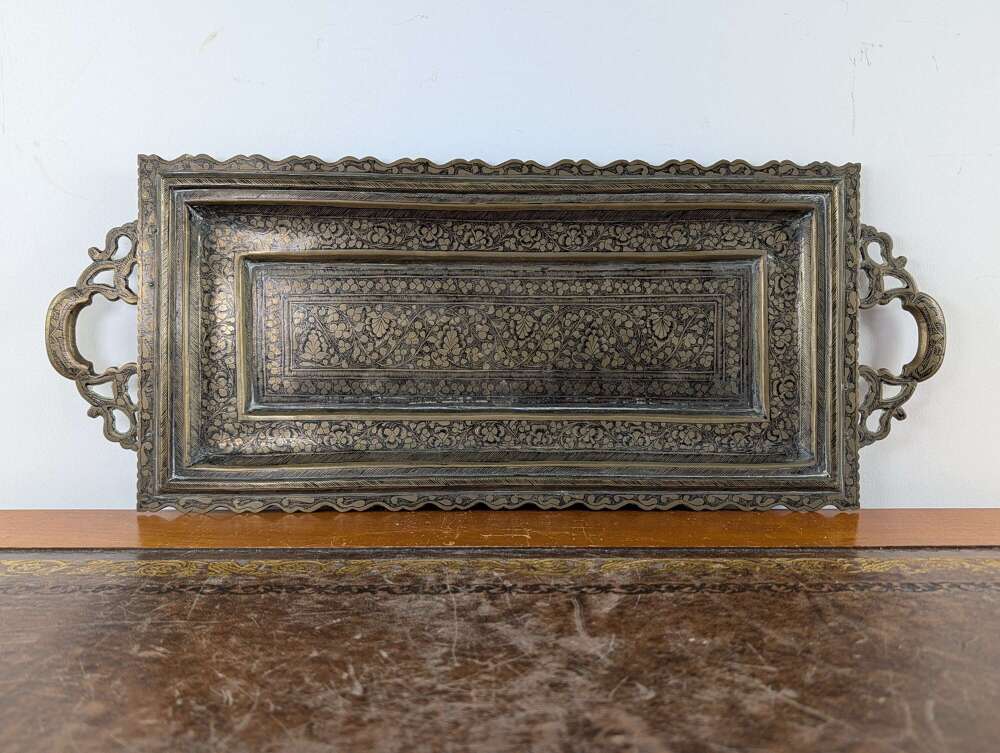 Indian brass niello tray with engraved floral decoration, early 20th century
