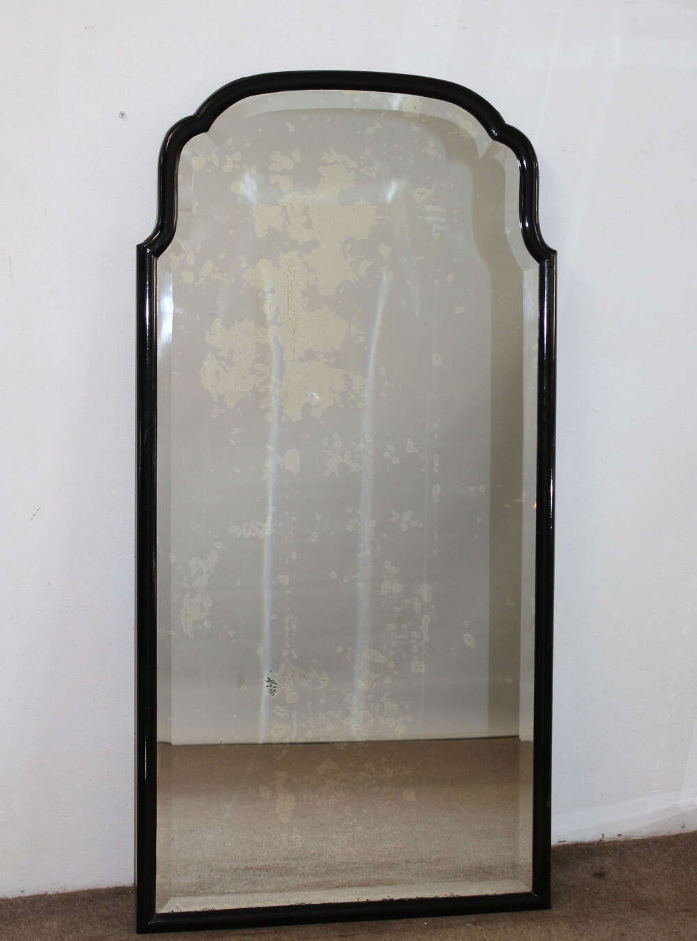 Tall antique French mirror with ebonised frame