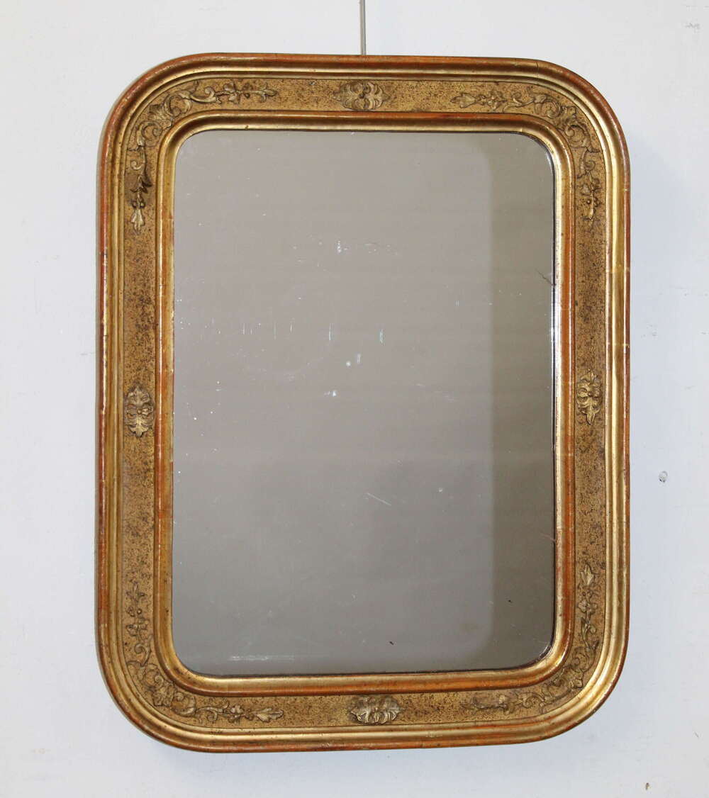 Antique French gilt mirror with curved corners
