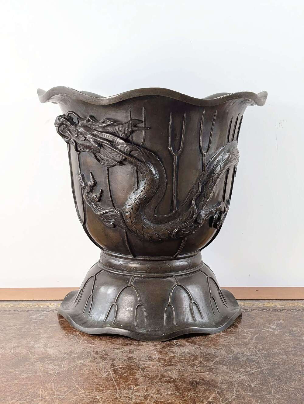 Japanese bronze dragon jardiniere in lotus form, Meiji period, late 19th century