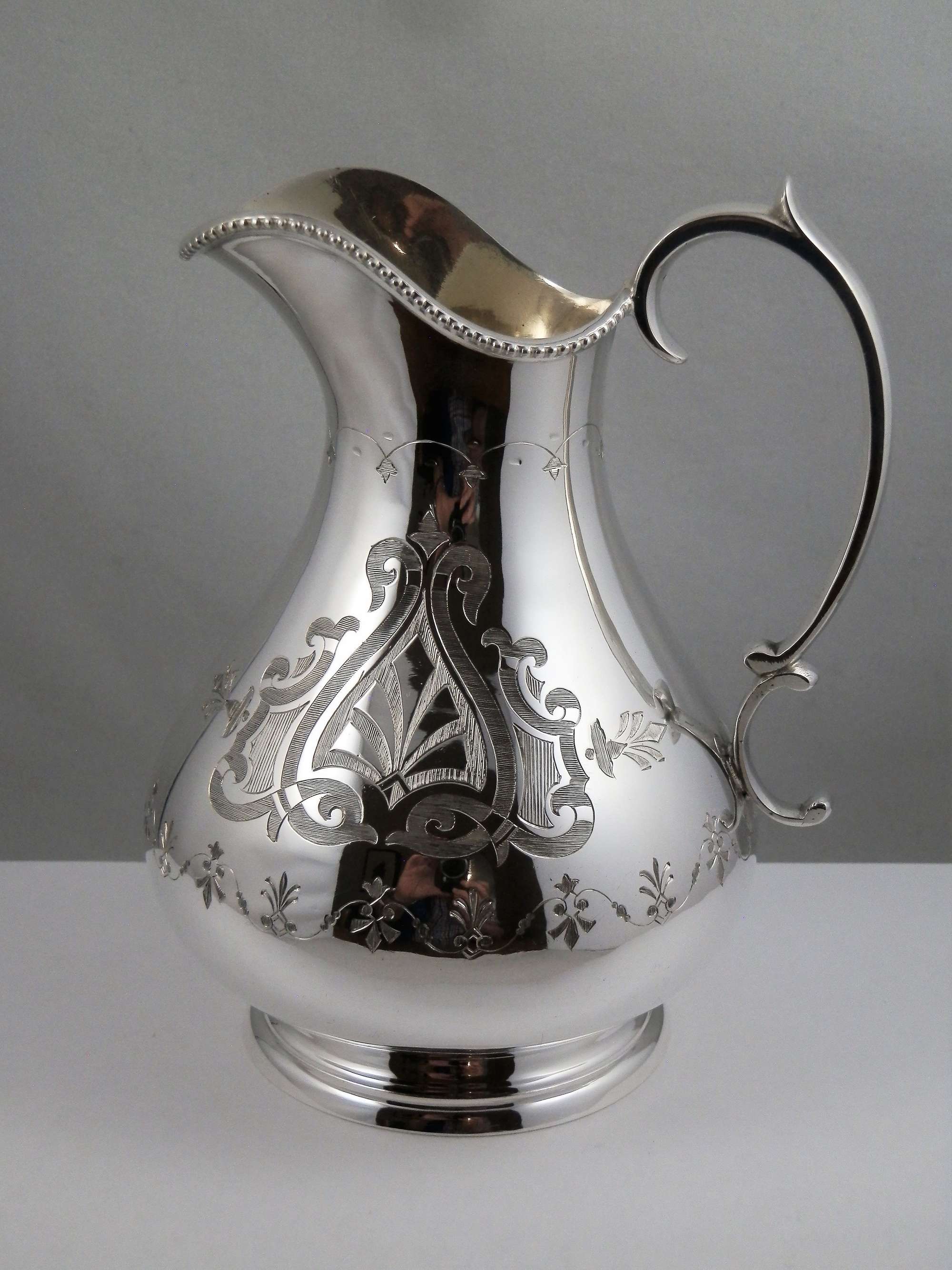 Victorian silver Gothic style cream jug, Sheffield 1869