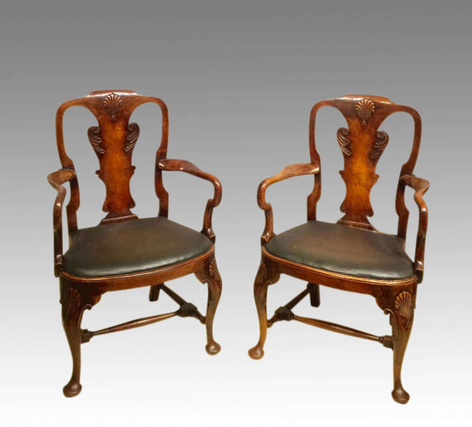 Pair of antique walnut armchairs in the Queen Anne style.