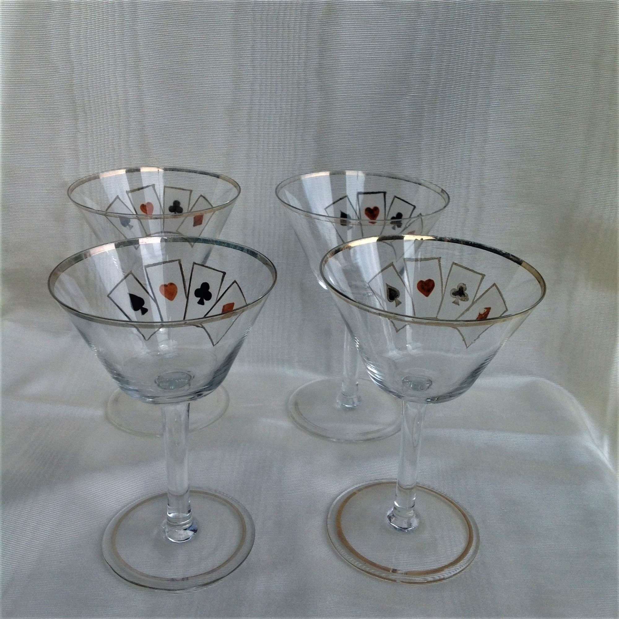 Four delicate hand-enamelled art deco playing card cocktail glasses