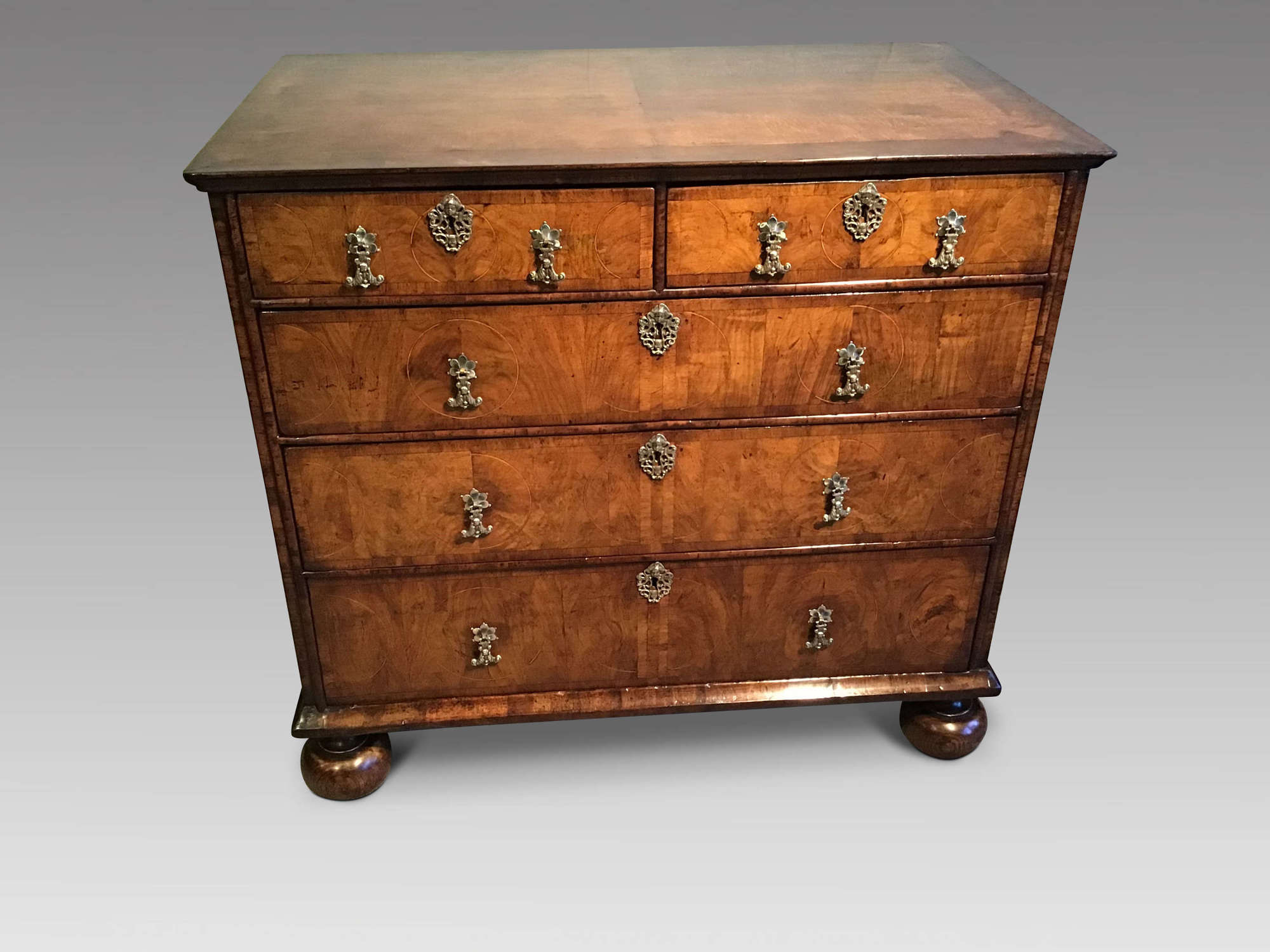 Antique walnut chest of drawers.
