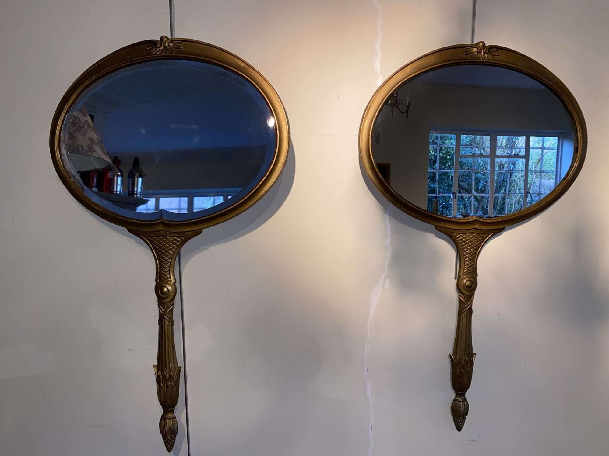 Unusual pair of Italian metal looking glass mirrors