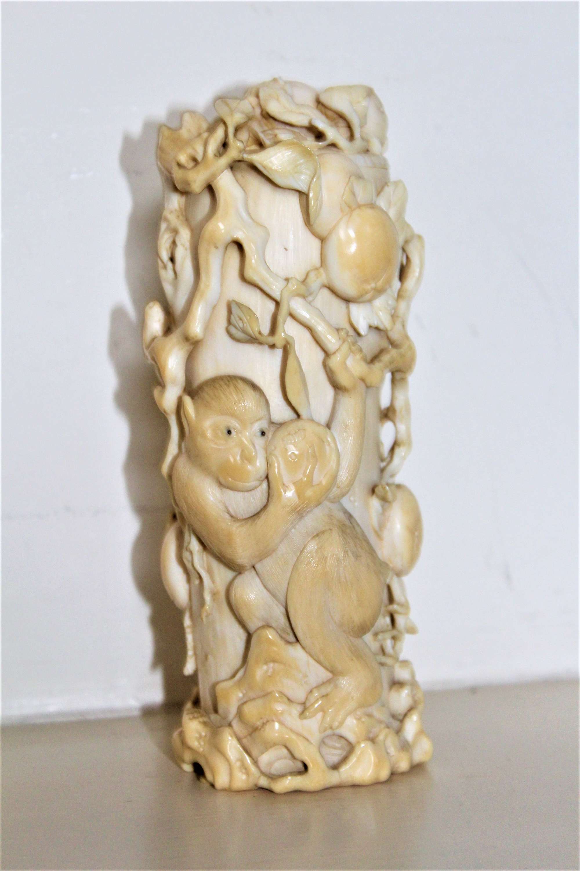 A Finely Carved Japanese Ivory Lidded Pot With Fruit And Animals