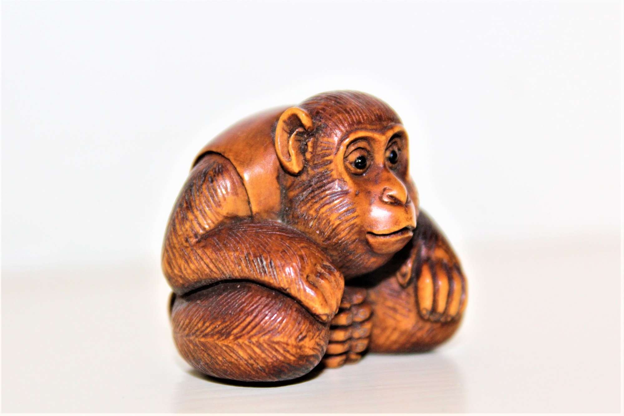 A Fine Quality And Signed Carved Boxwood Netsuke Of A Crouching Monkey