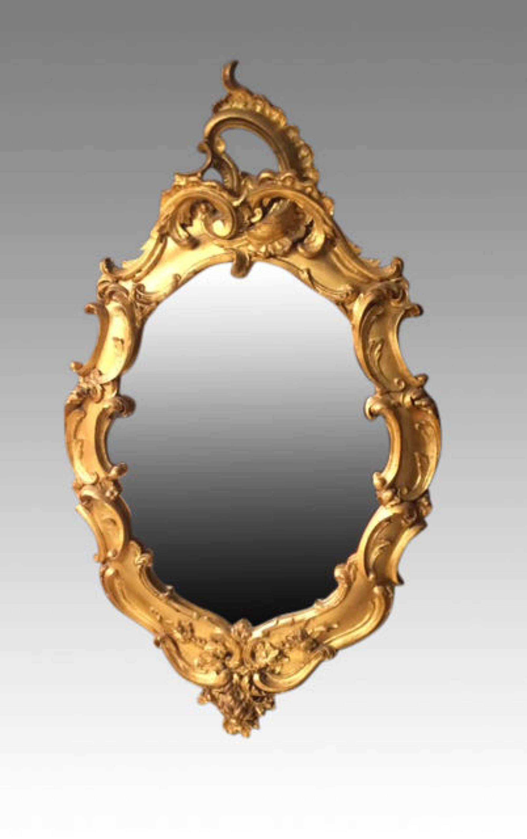19th century oval carved giltwood mirror.