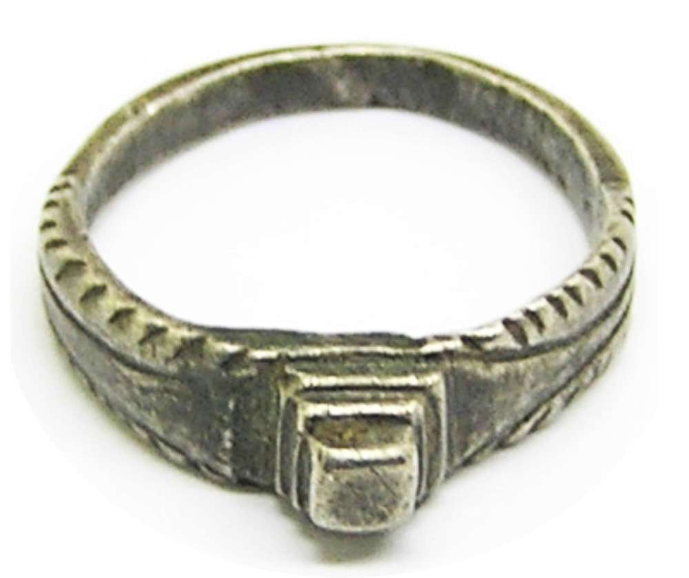 Medieval silver stirrup sing with a raised diamond bezel