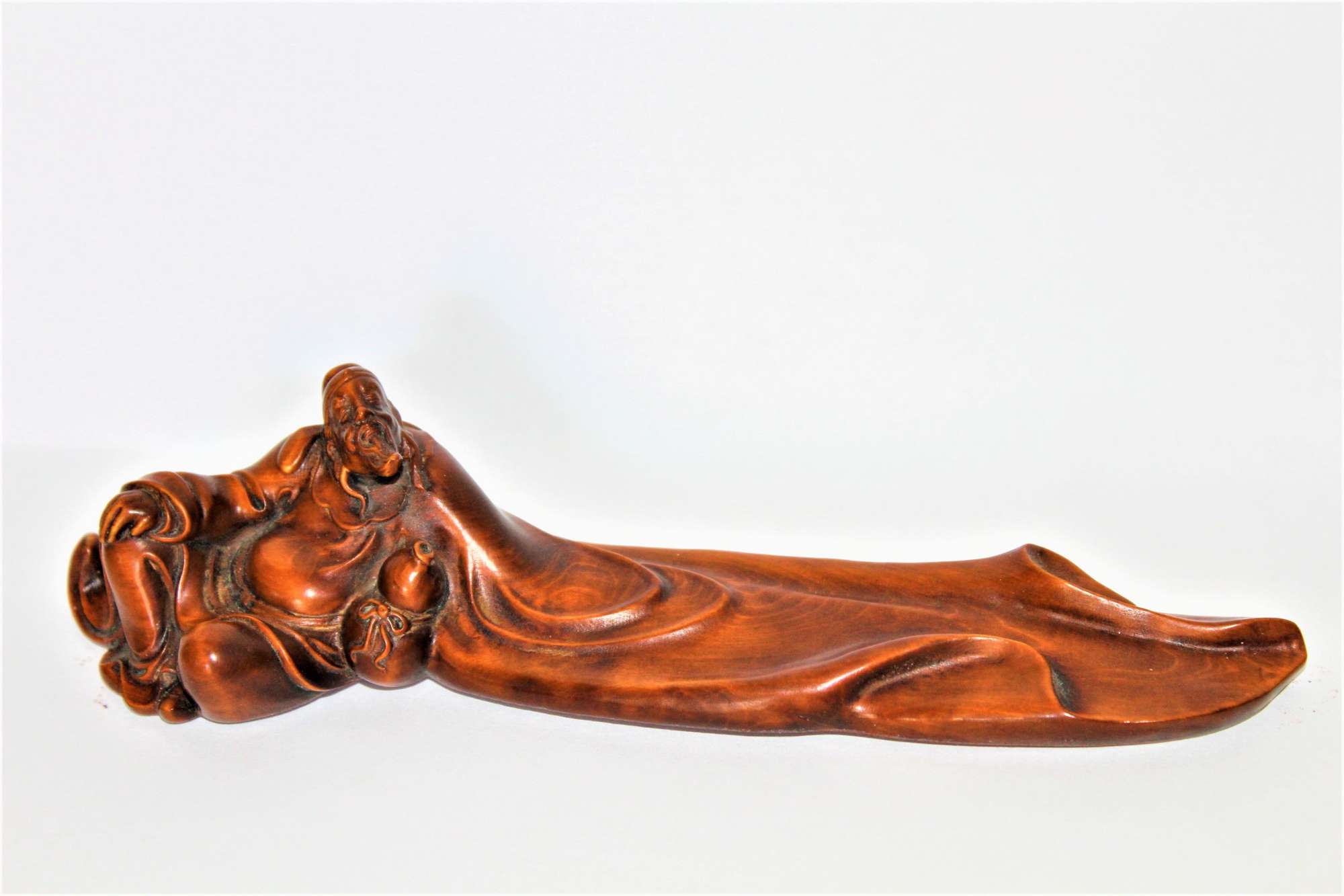 A Well Carved Chinese Boxwood Figure Of A Reclining Scholar