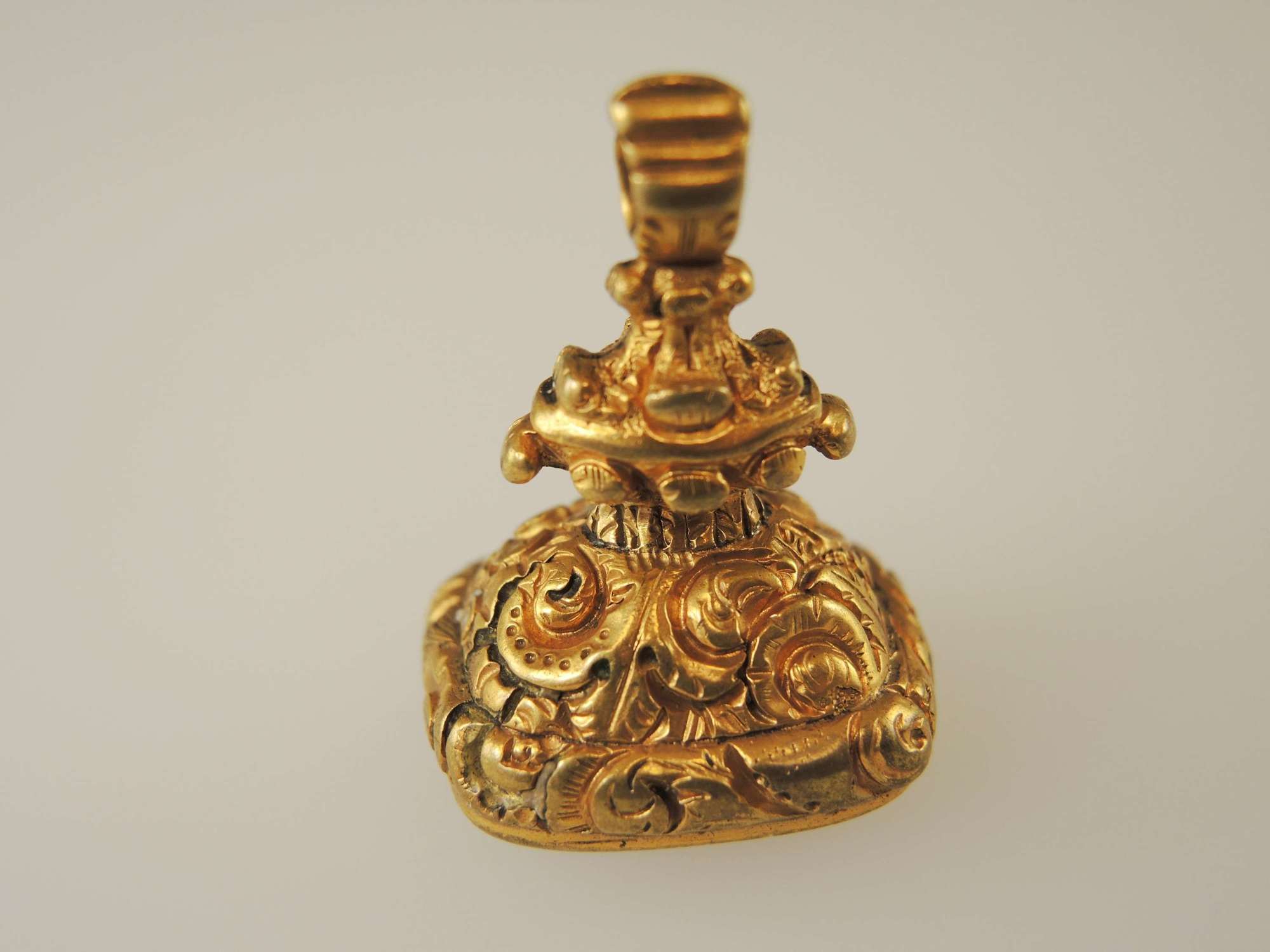 Victorian gilt cased seal set with a red stone c1850