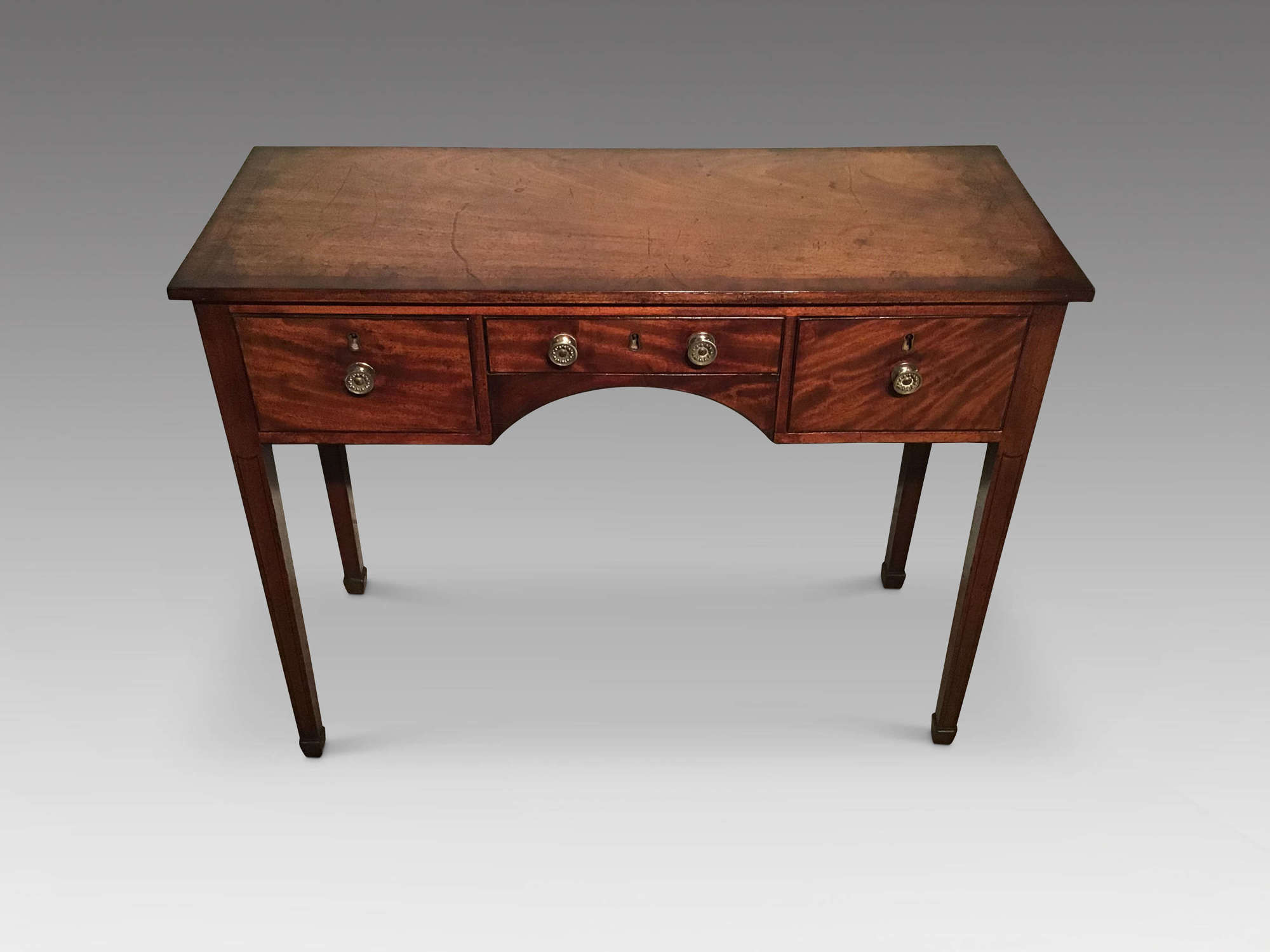 Antique mahogany kneehole table.