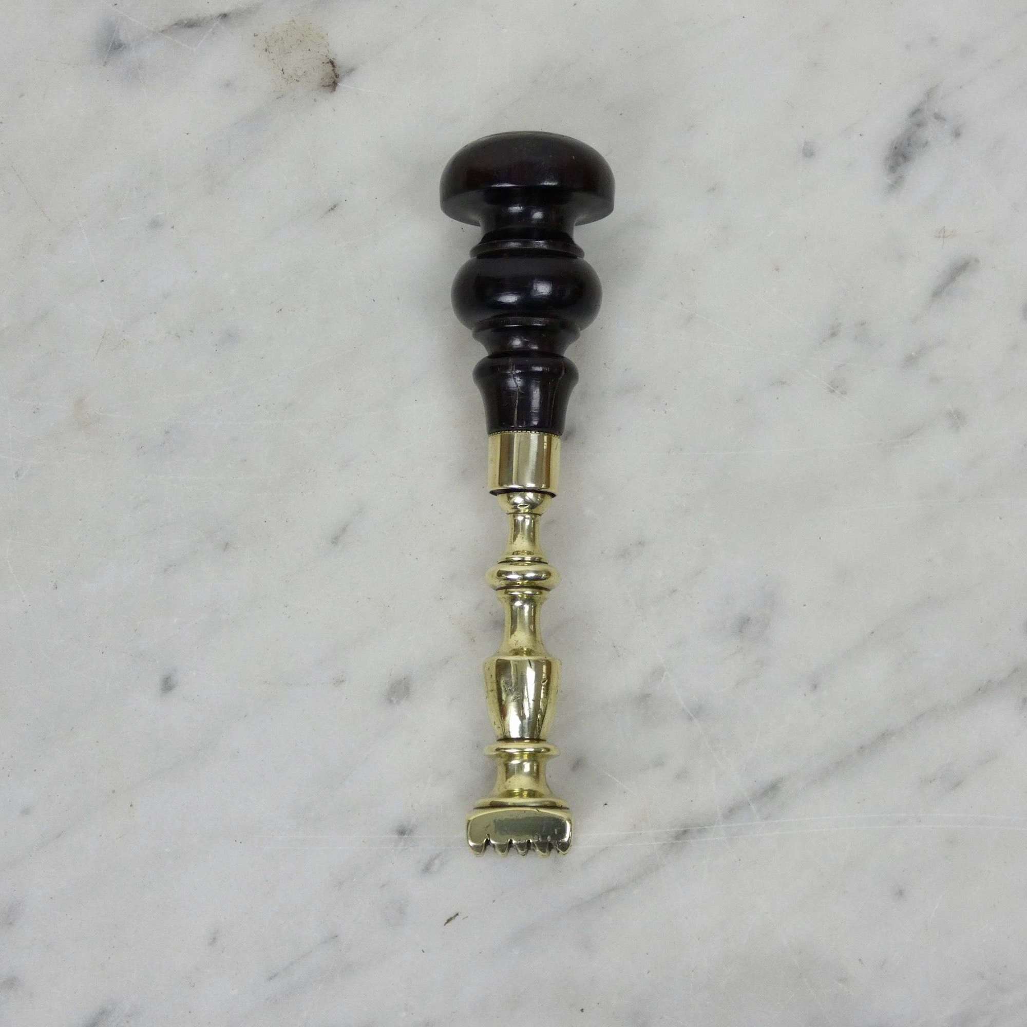 Brass pastry tool with ebonised handle