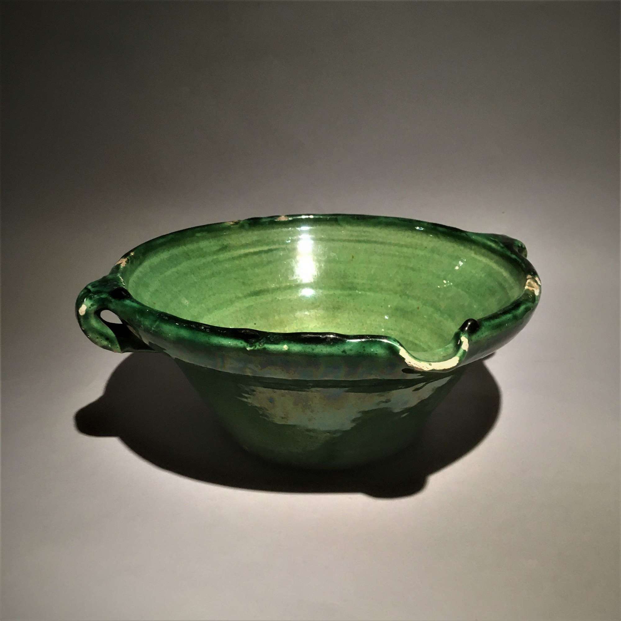 A French green glazed earthenware dairy bowl or 'tian'