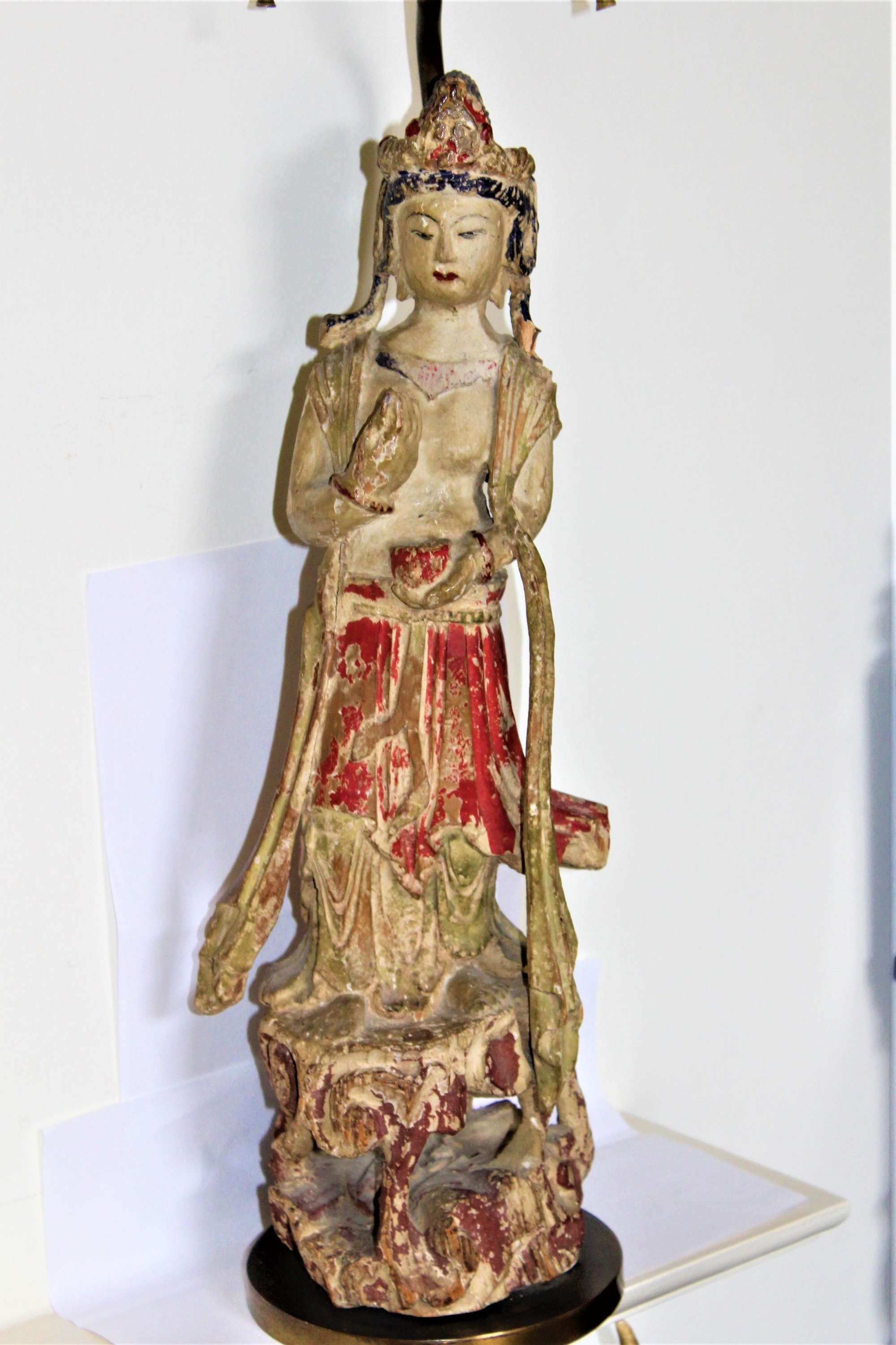 An Antique Distressed Carved Wood And Polychromed Figure Of Quan Yin