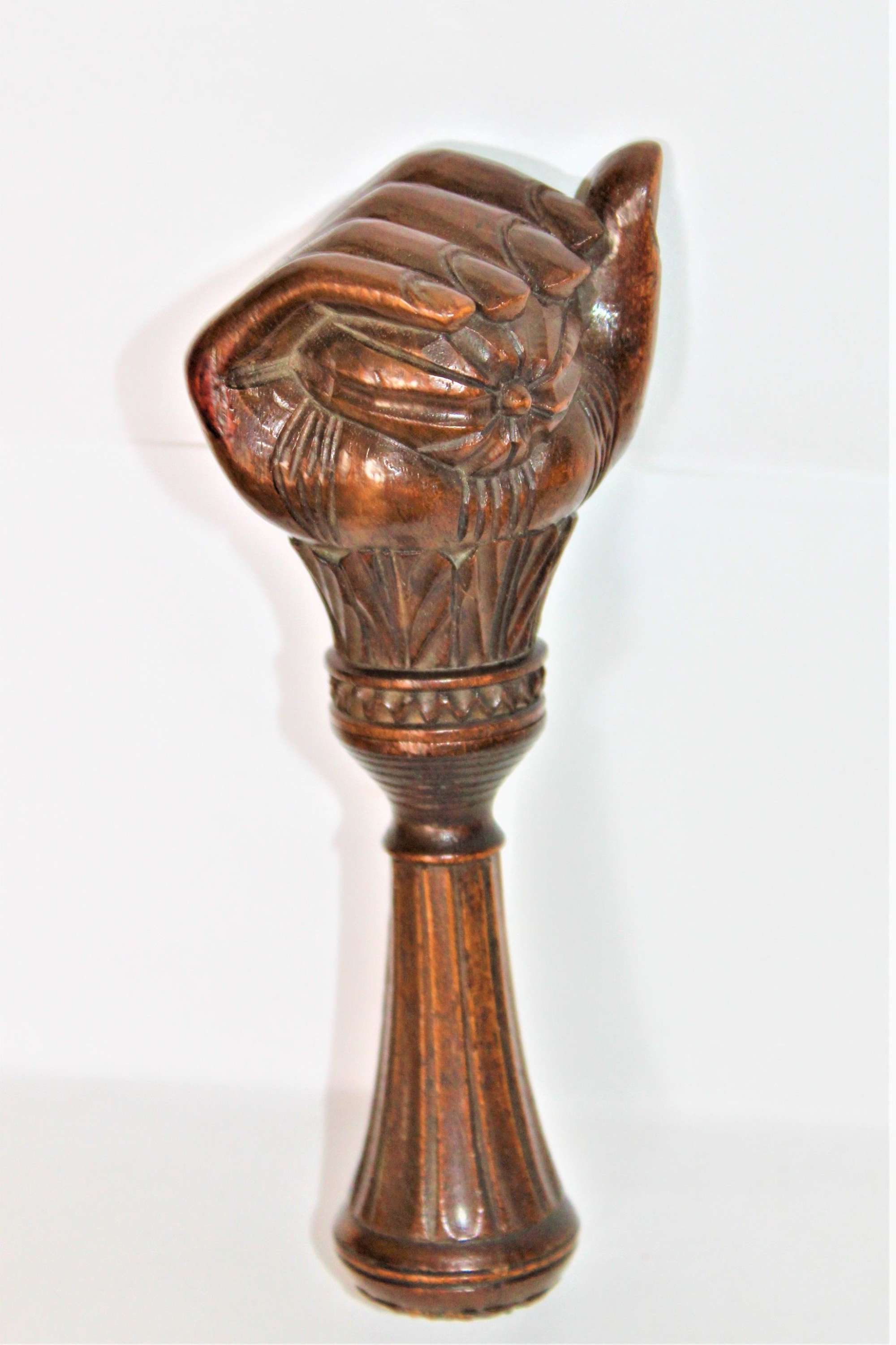 A Finely Carved Wood Black Forest Nut Cracker Depicting A Fist