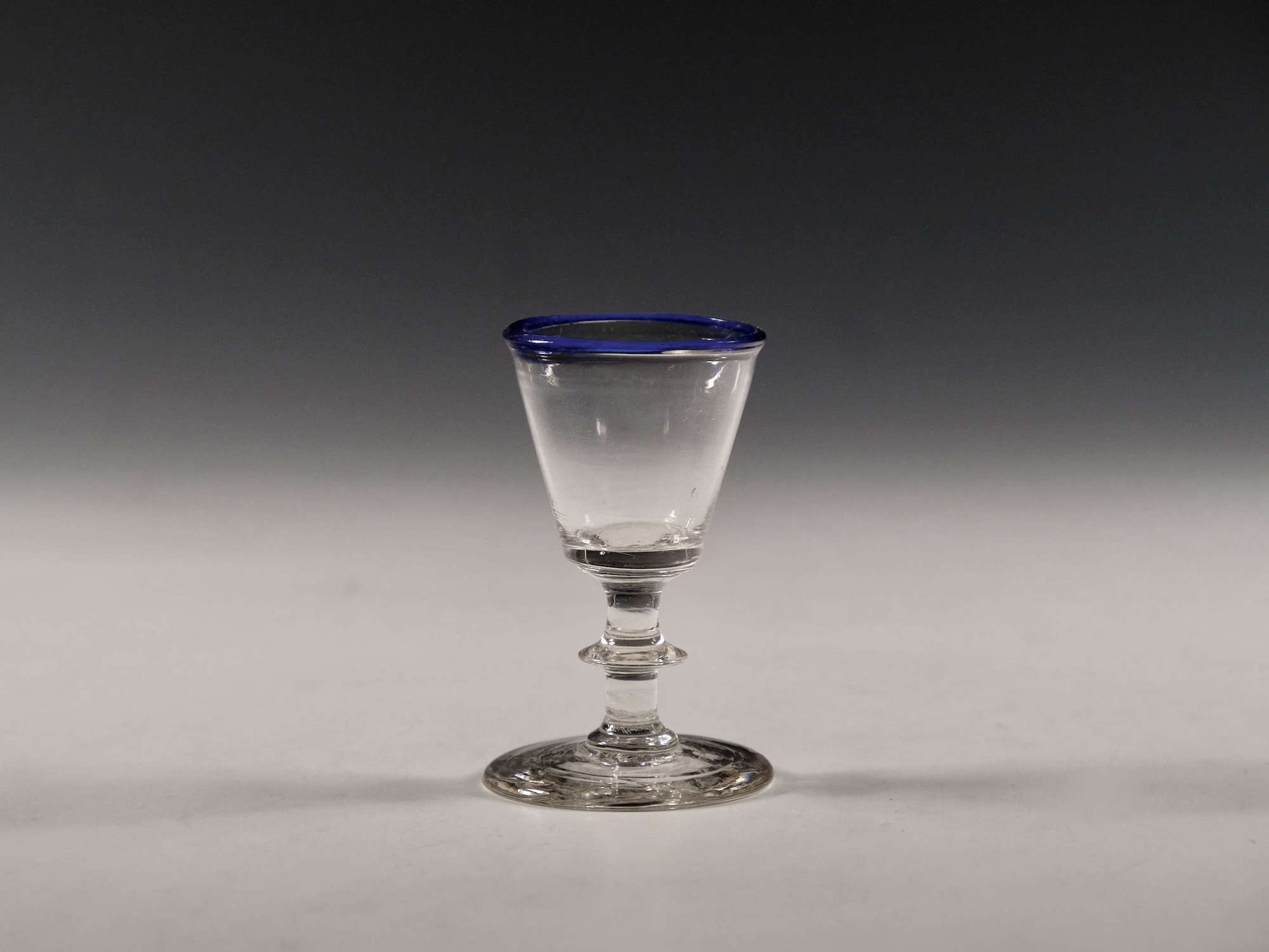 Antique glass dram with blue rim English c1820