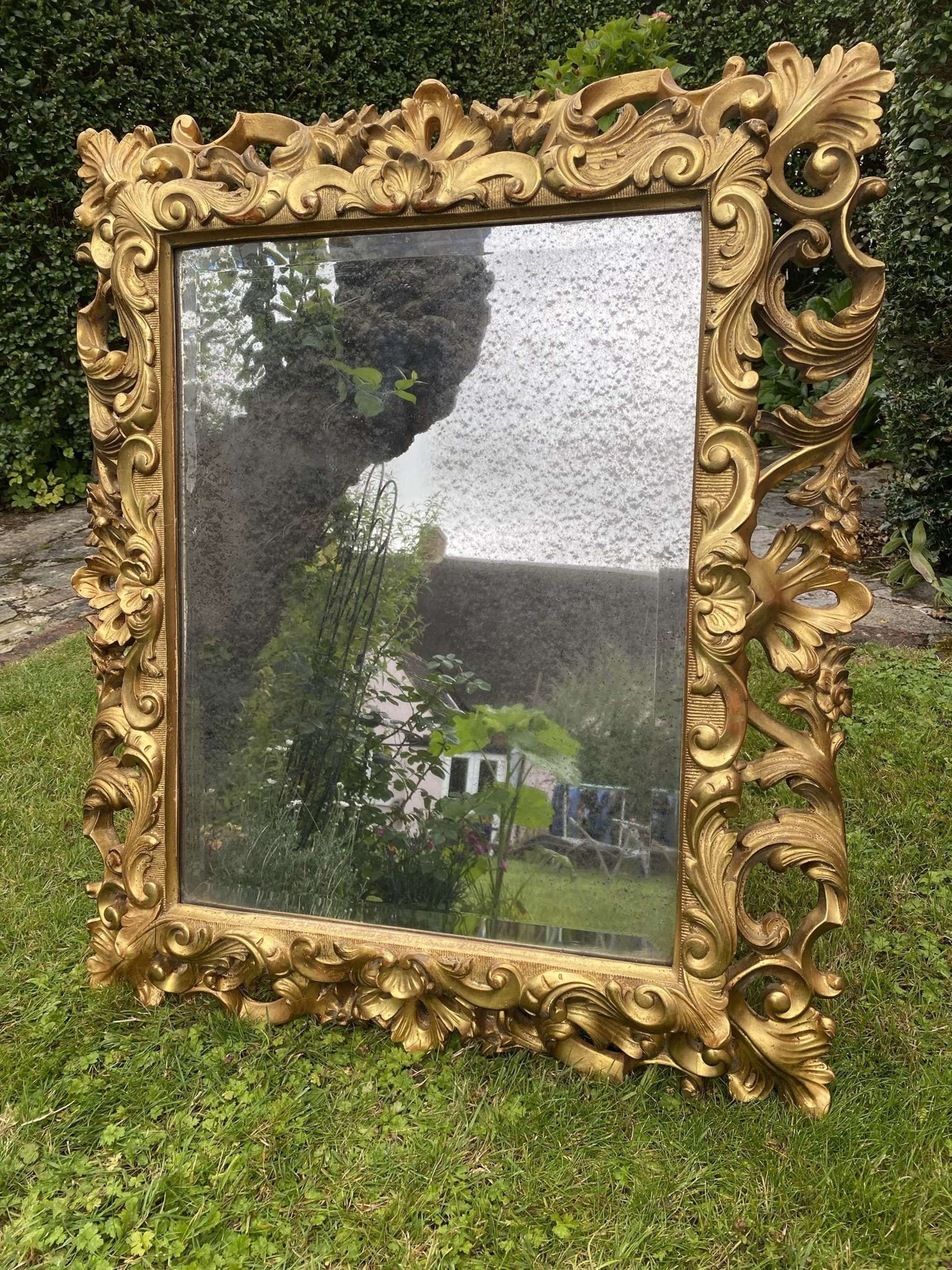 Carved giltwood cushion mirror