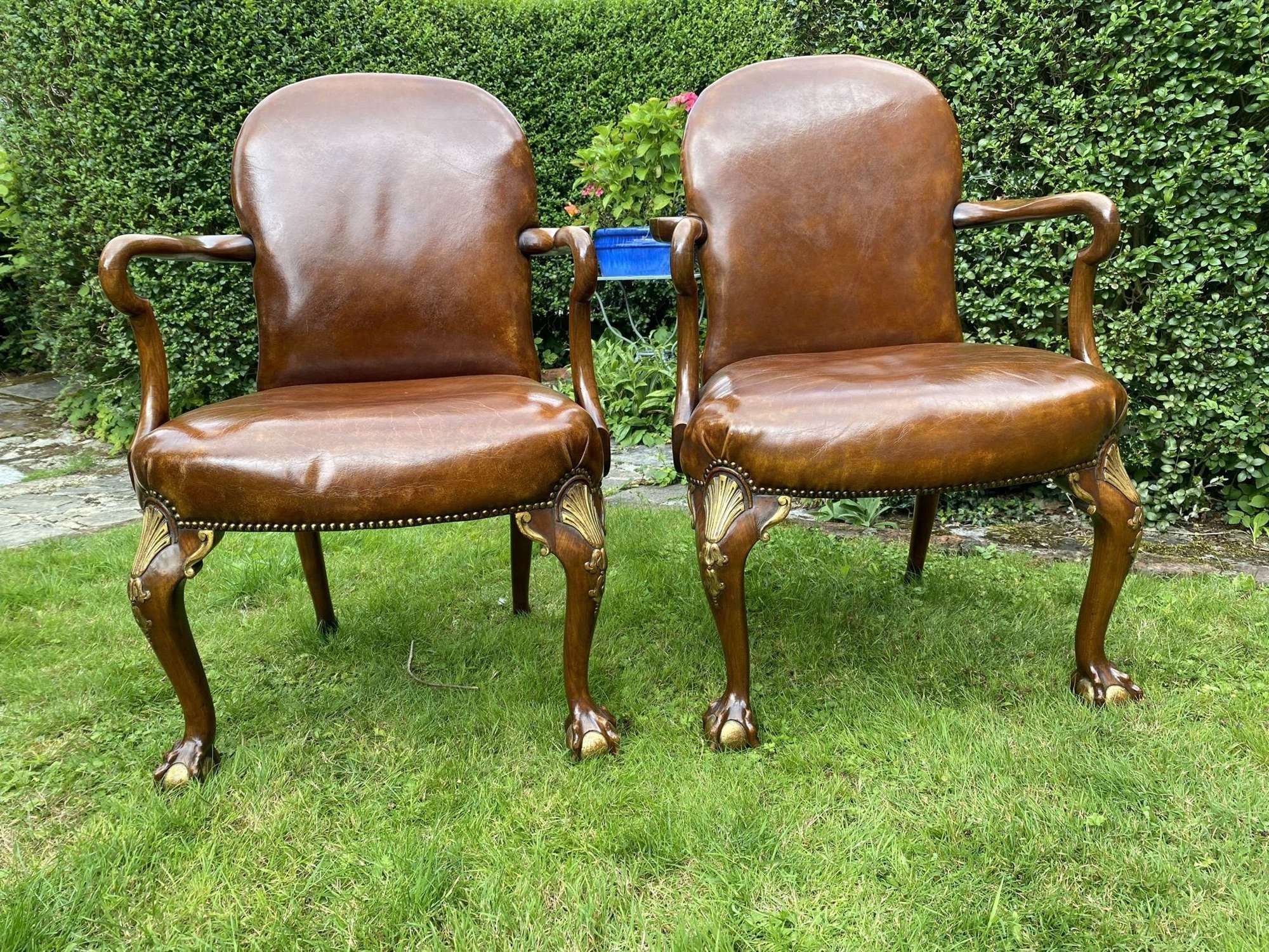Pair of leather and gilt armchairs