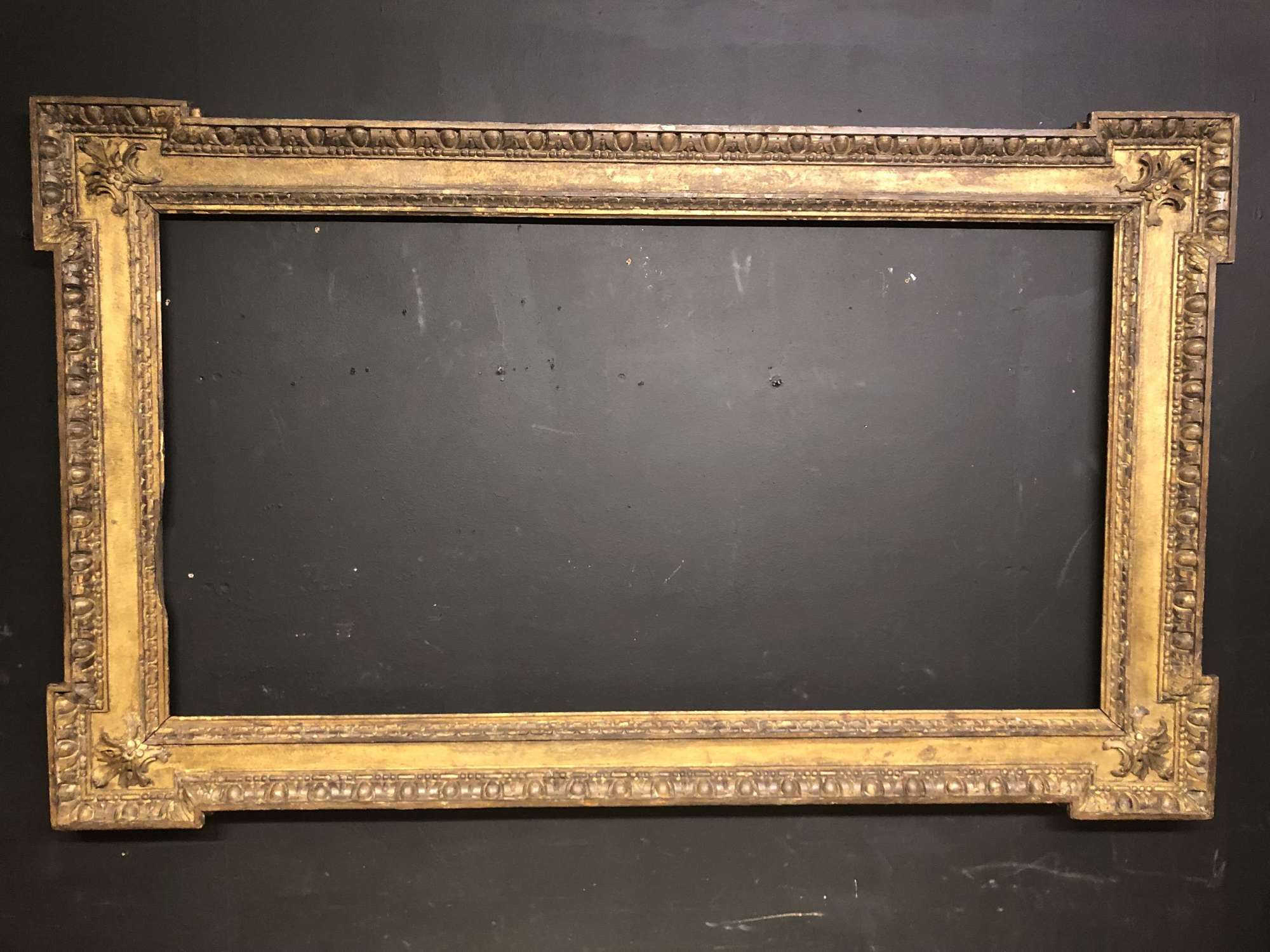 Large 18th century carved giltwood picture frame.