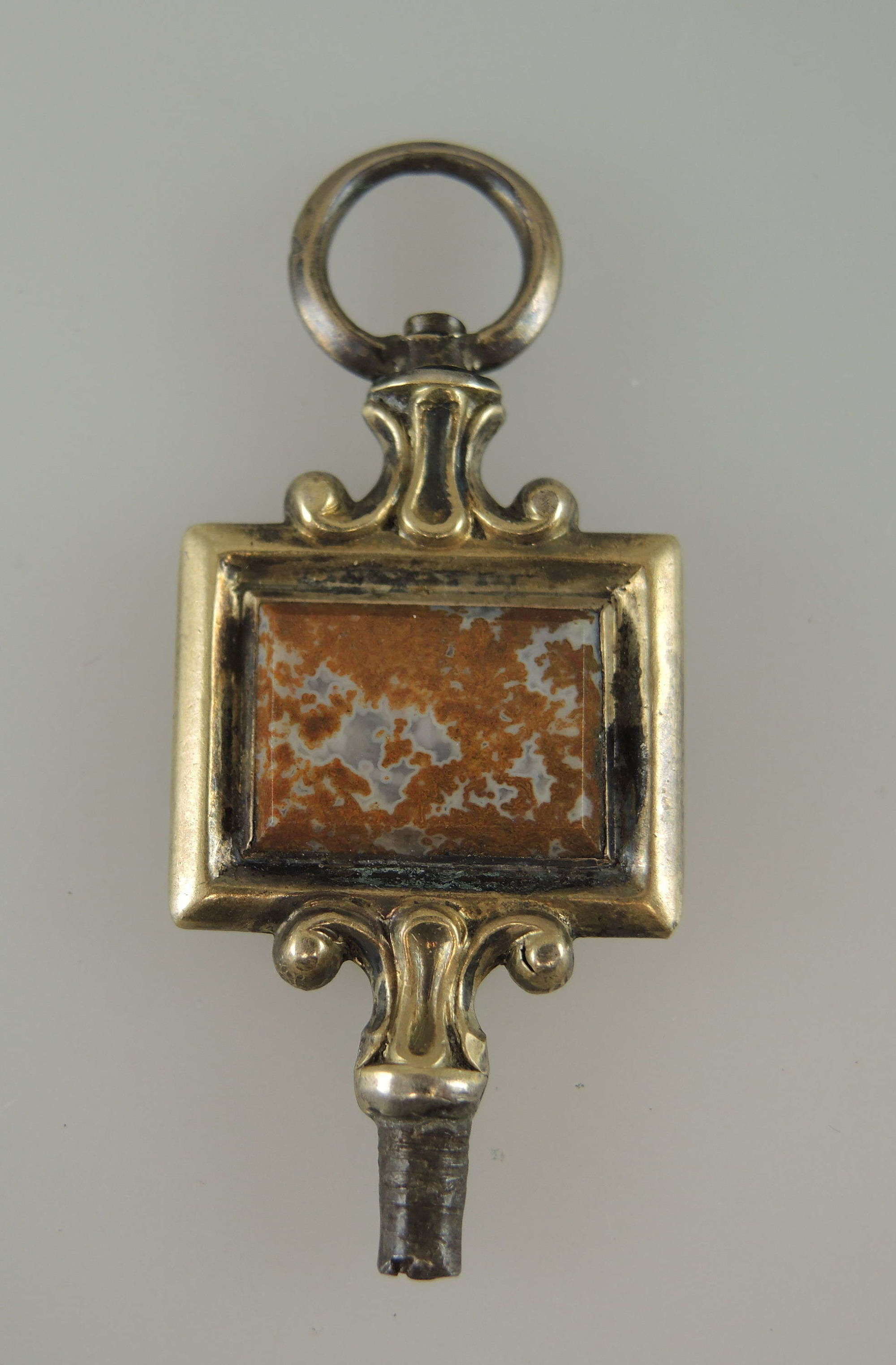 Fancy gilt and marble set pocket watch key c1835