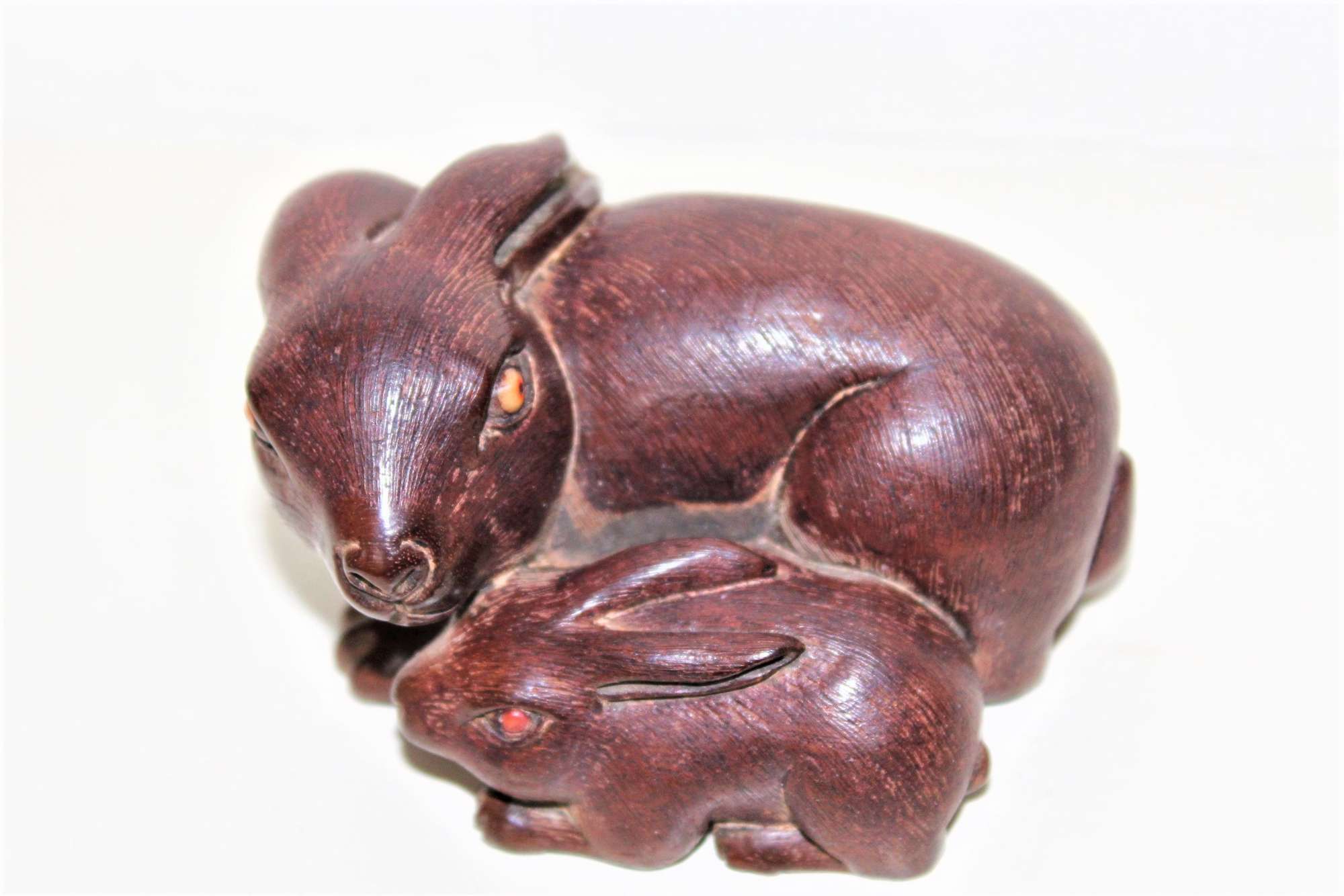 A Finely Carved And Charming Wood Okimono Of Two Rabbits