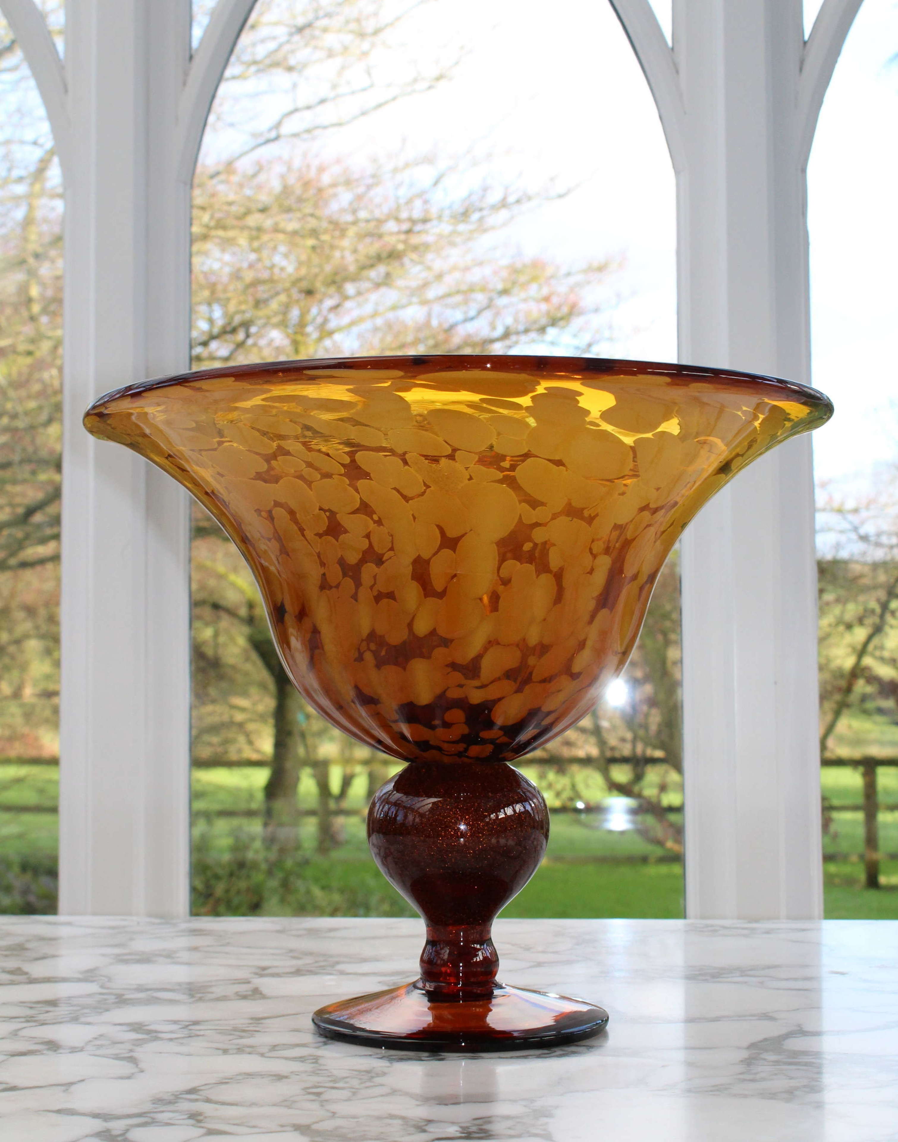 Large Continental amber glass bowl on pedestal