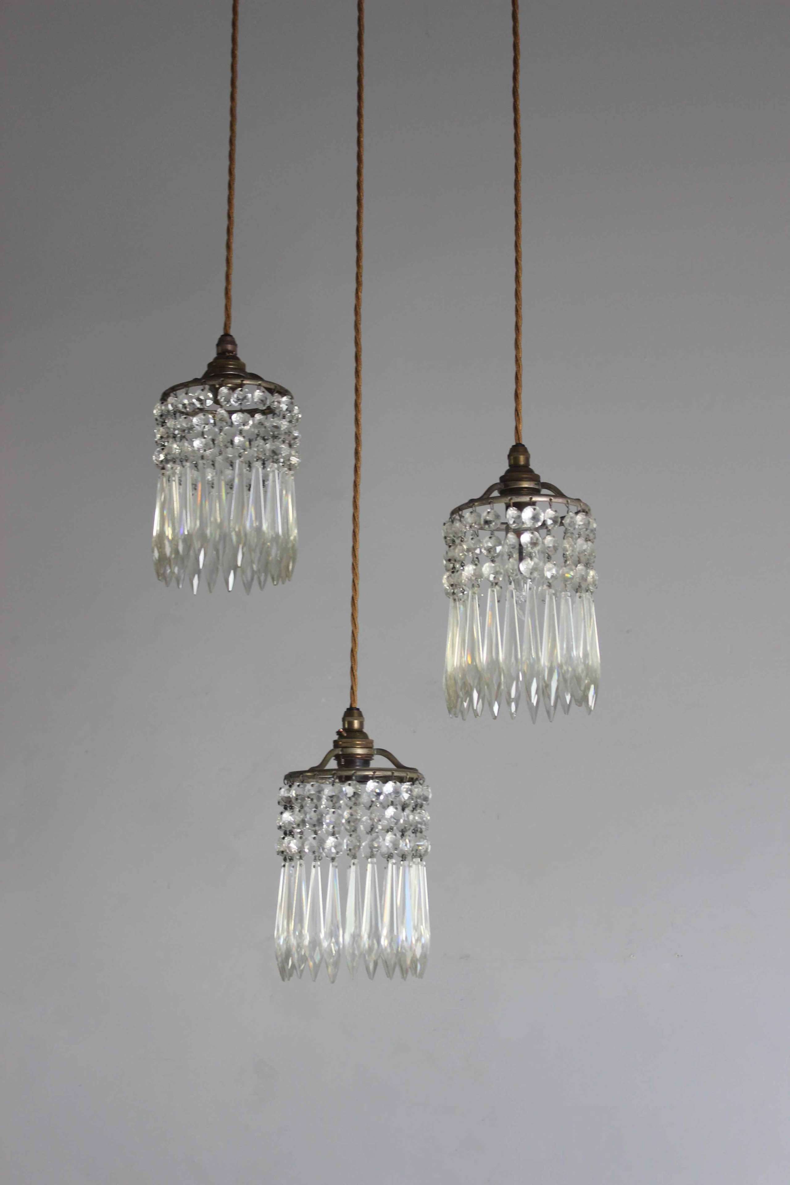 Set of three cut glass chandelier pendants