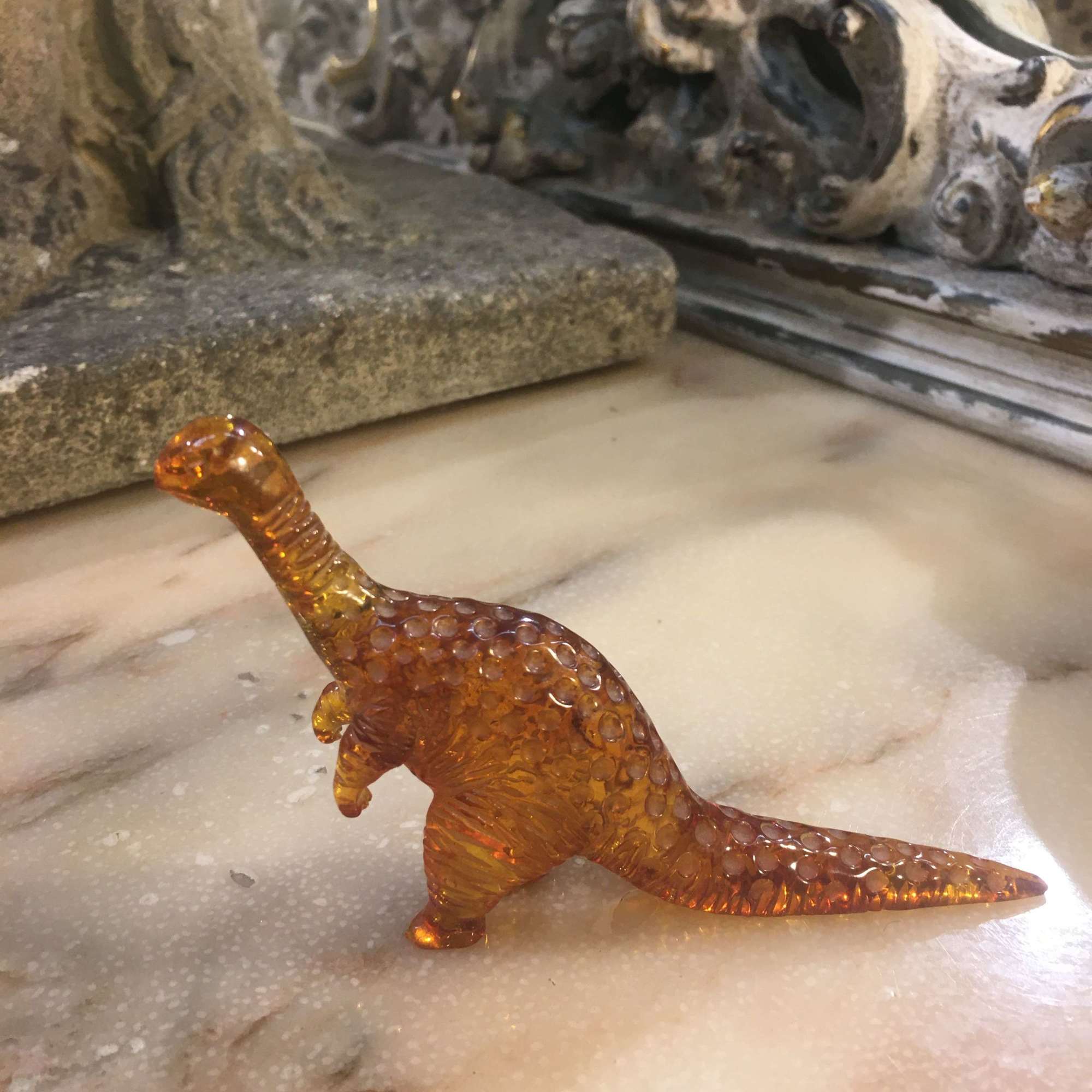 Amber dinosaur ornament
