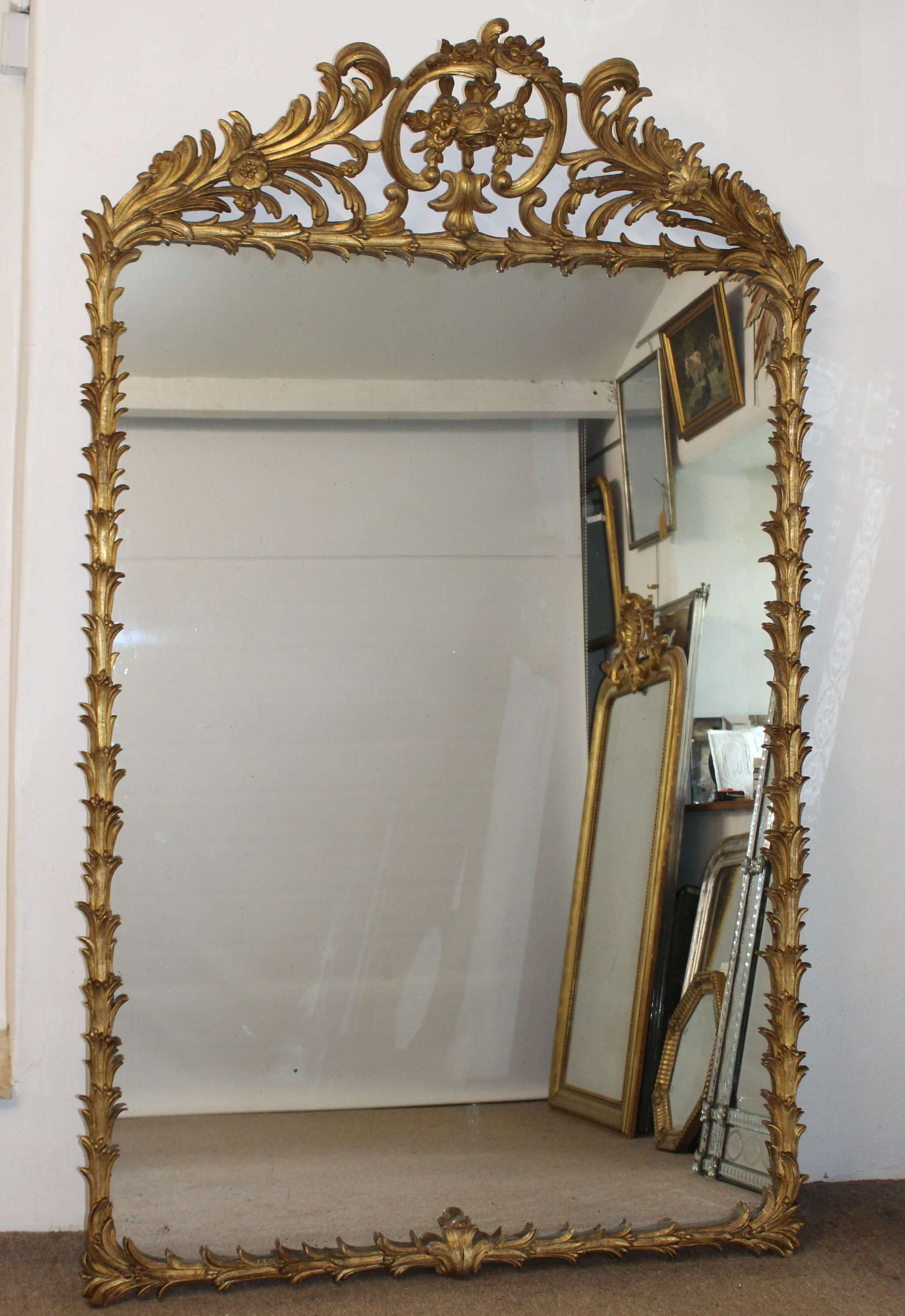 Large, decorative, antique palm leaf framed mirror