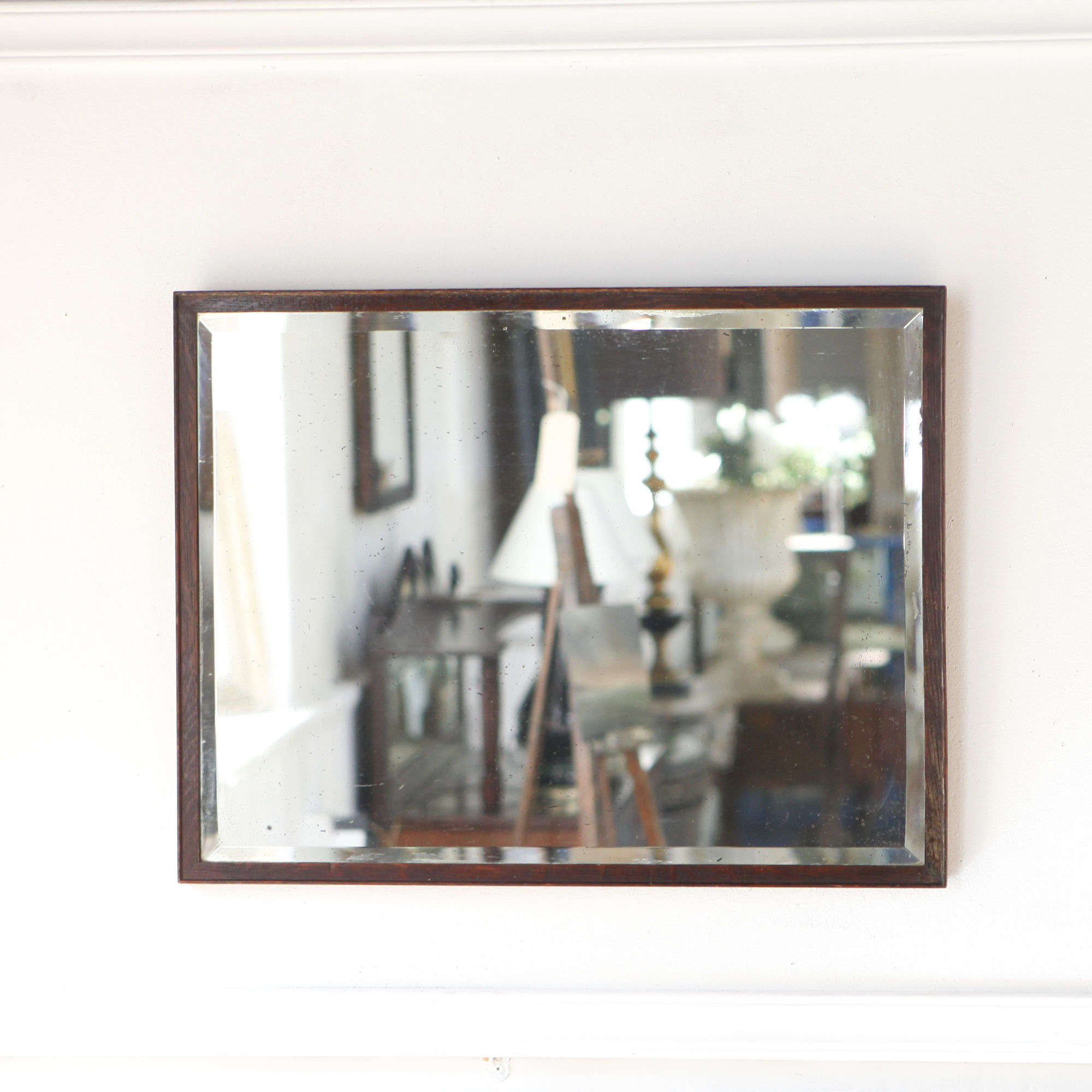 Oak mirror with wonderful lightly foxed original bevelled plate.