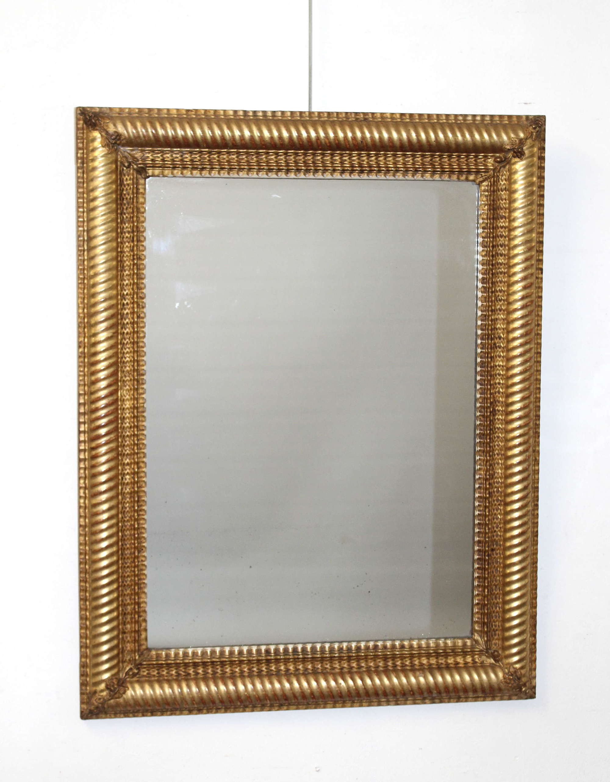 Antique French ripple and ropetwist framed mirror