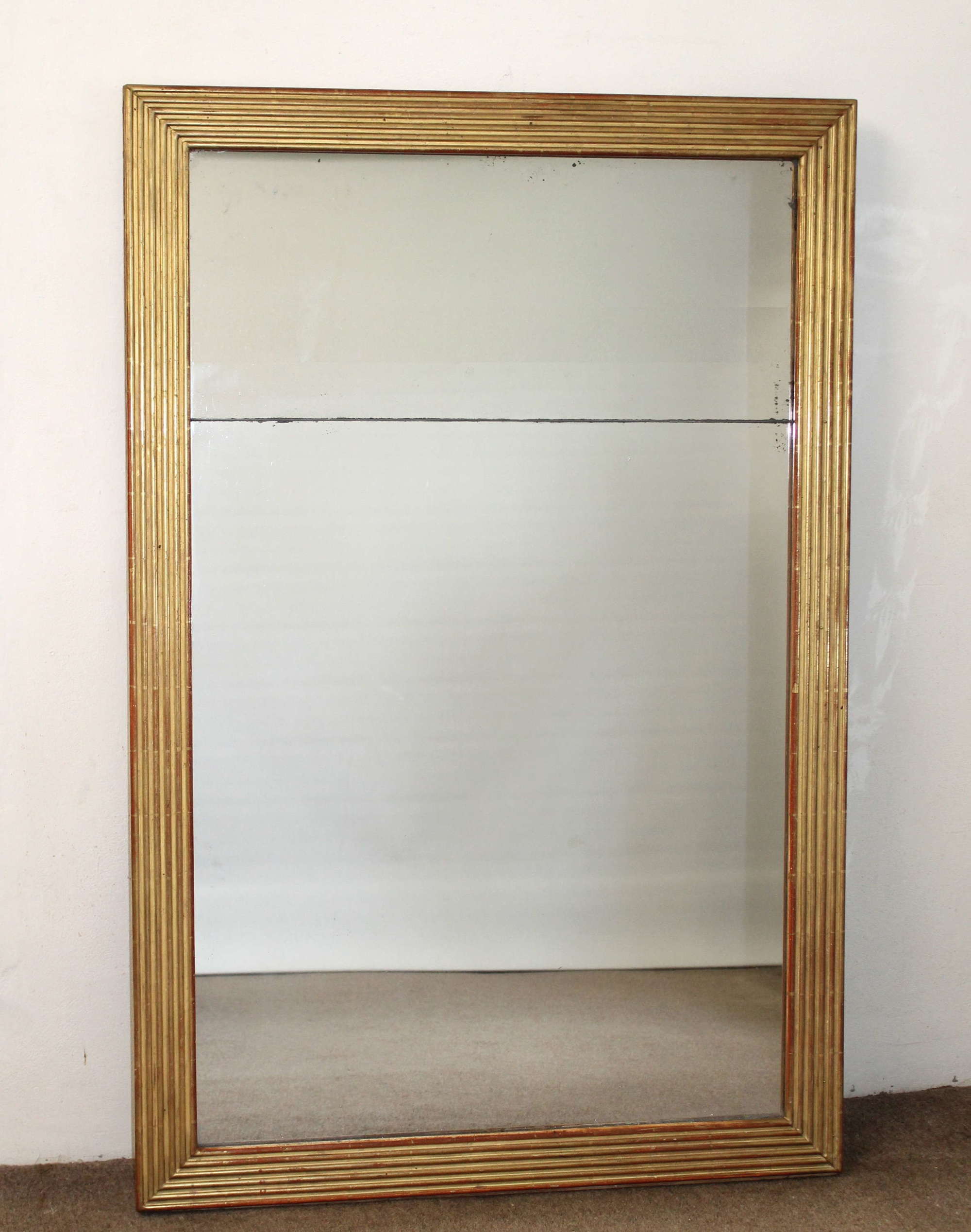 Antique French pier mirror with reeded frame