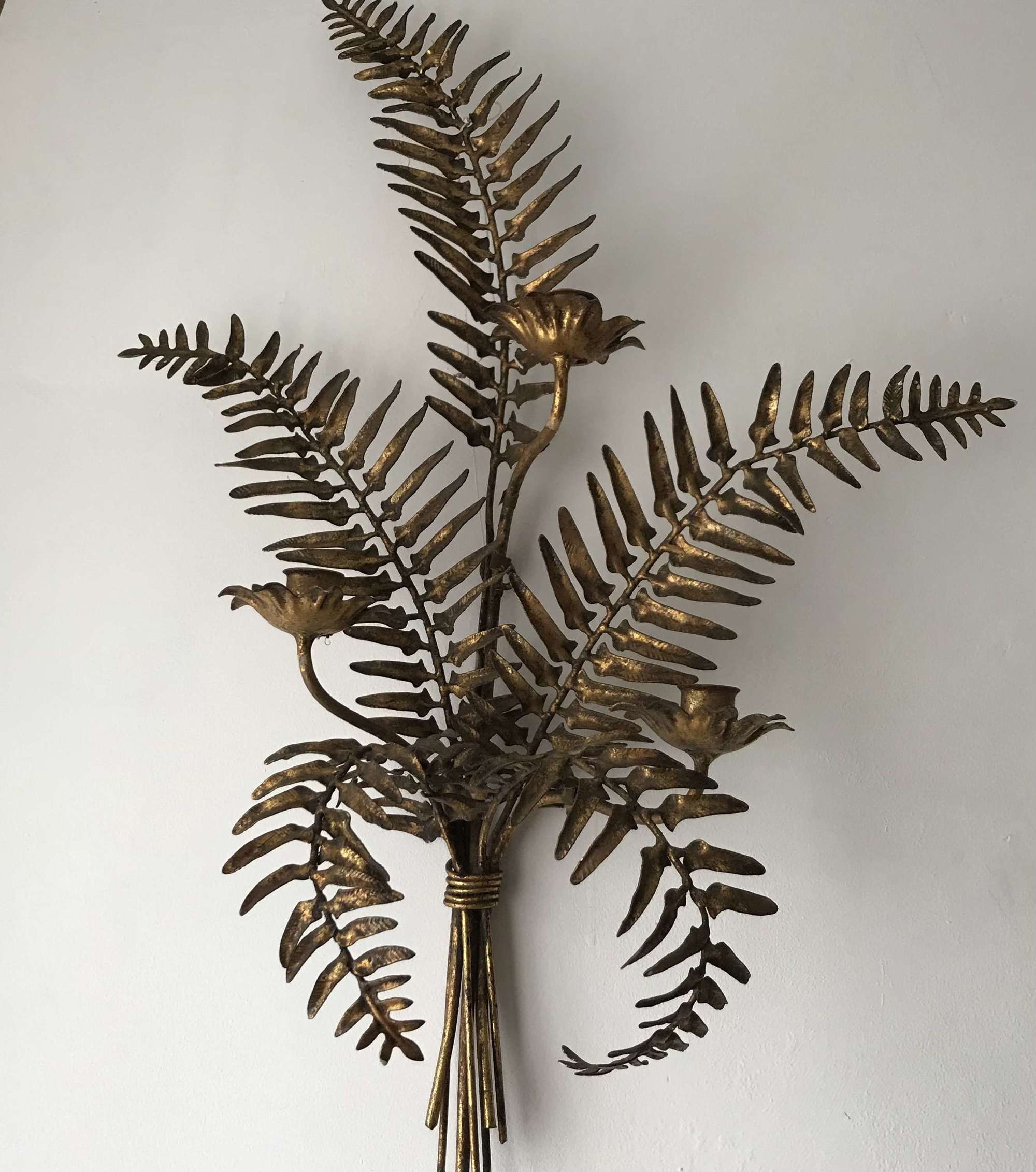Pair of stylised ferns as gilded metal candle sconces